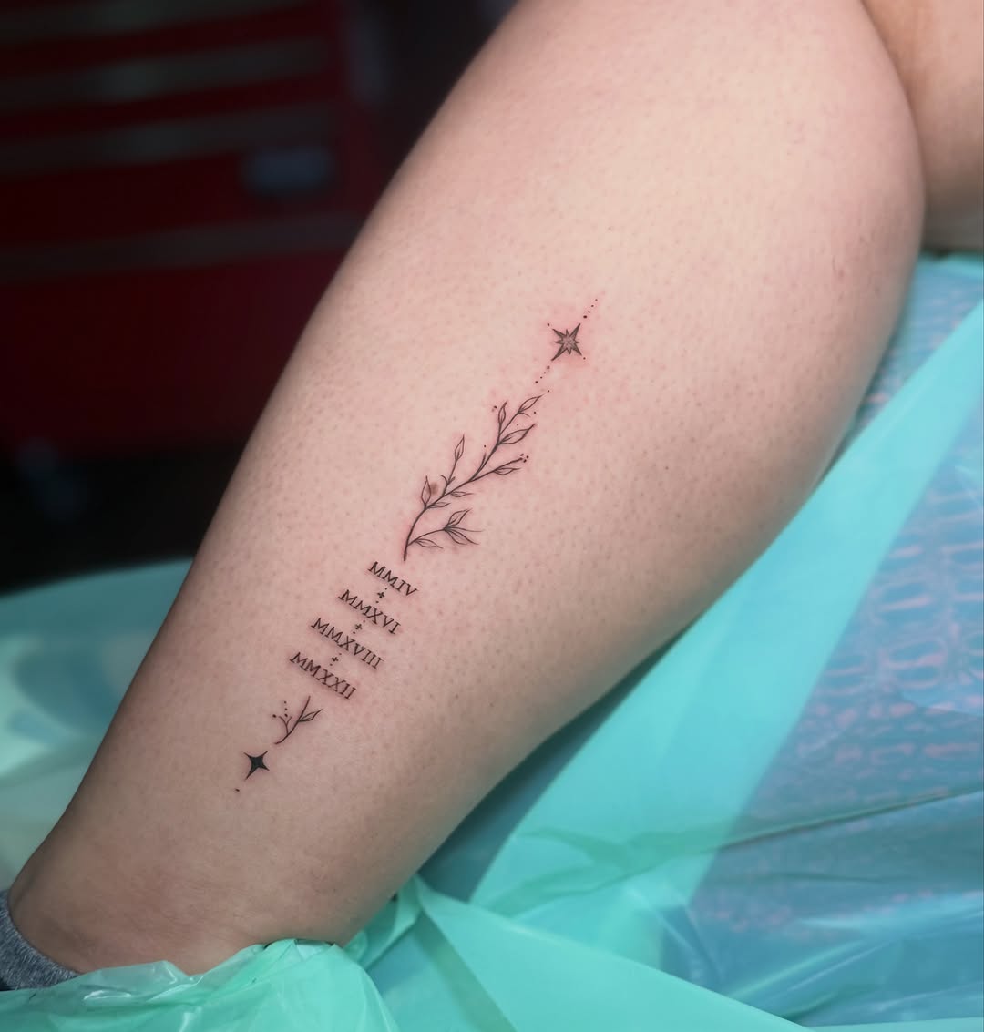 Branch with roman numerals and stars ornamental tattoo on the forearm by Jennifer Ramirez