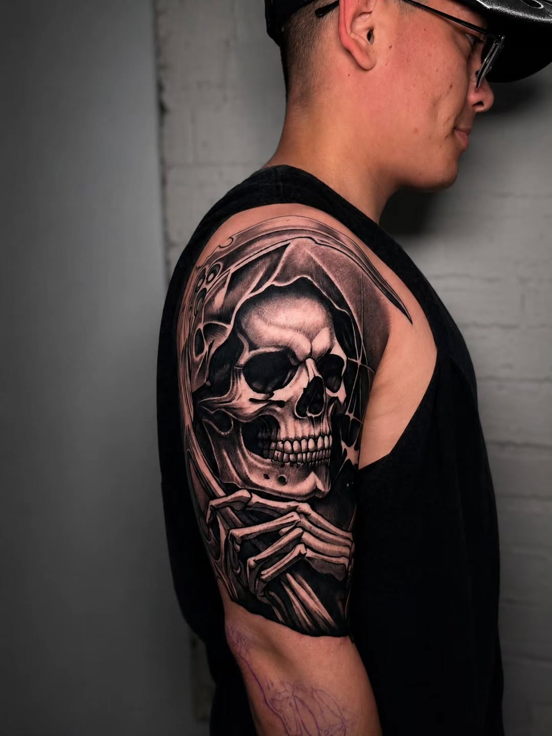 Grim reaper skull realism tattoo on the shoulder by Lukasz Olszanski