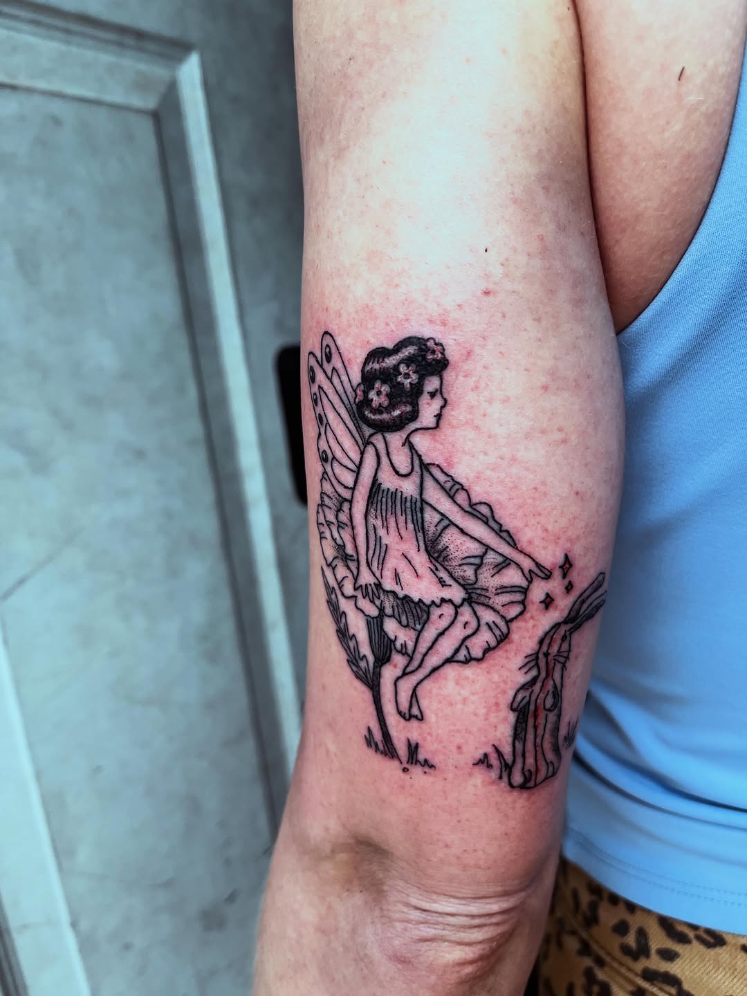 Fairy and rabbit fine line tattoo on the forearm by Rafaela Lopez