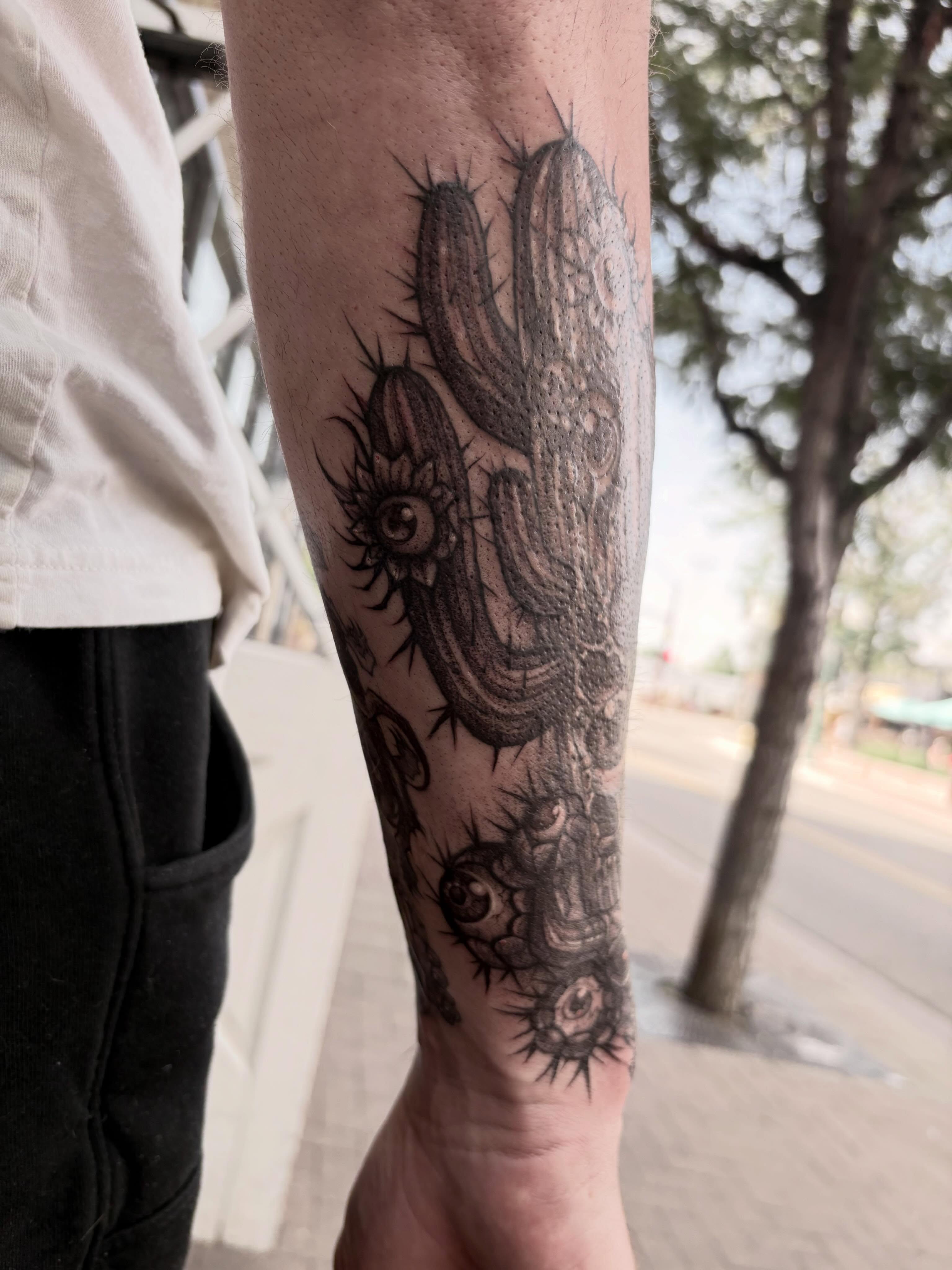 Cactus with eyes surrealism tattoo on the forearm by ๐ท๐๐๐๐