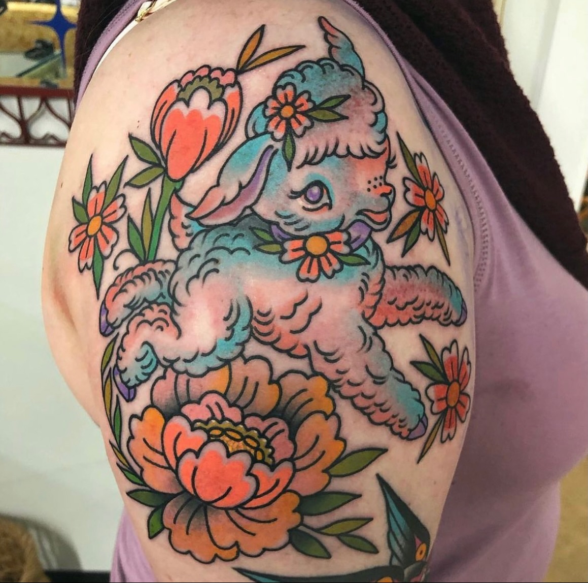 Poodle and flowers American traditional tattoo on the shoulder by Andrea Patterson