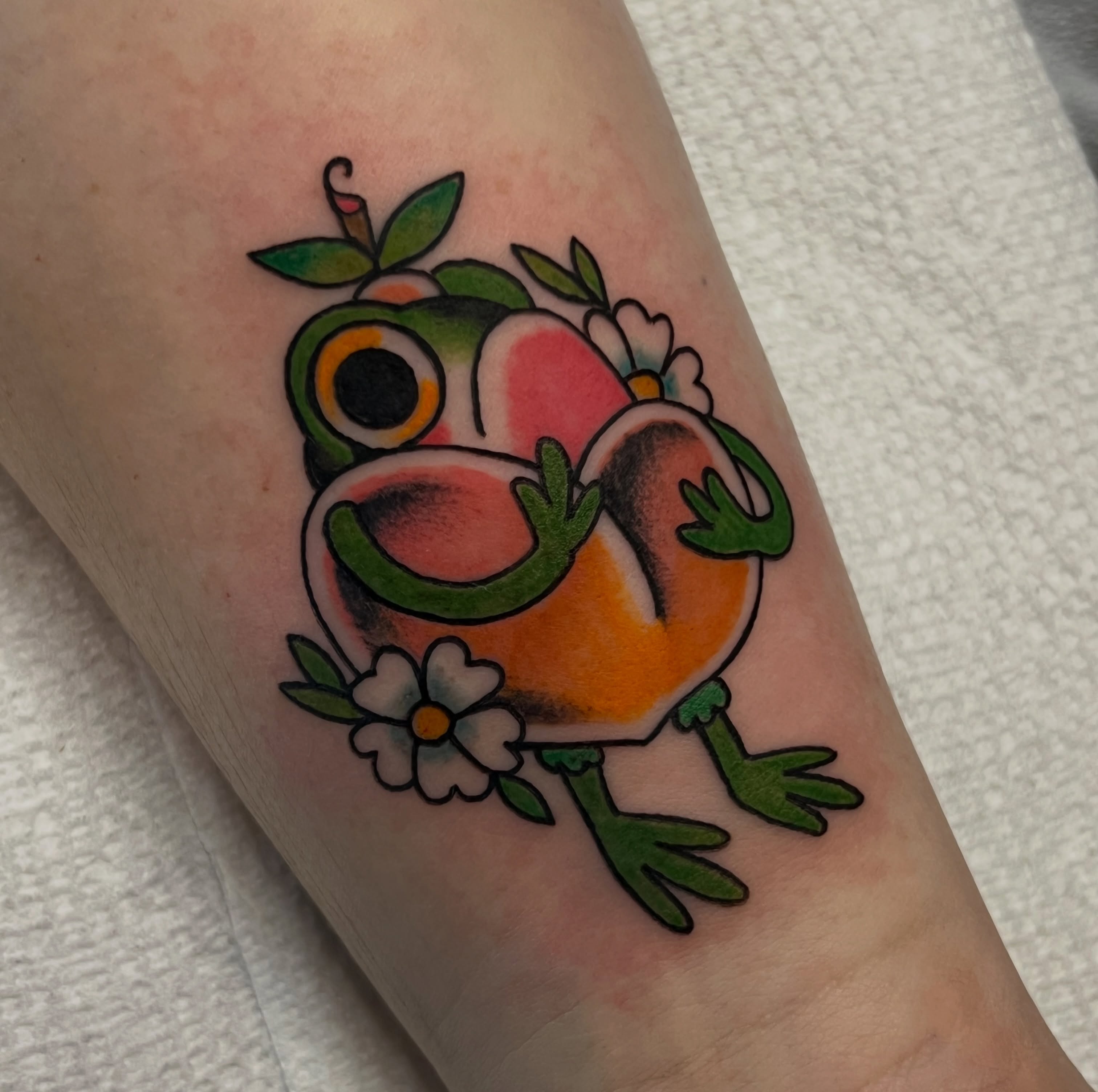 Frog American traditional tattoo on the forearm by Andrea Patterson
