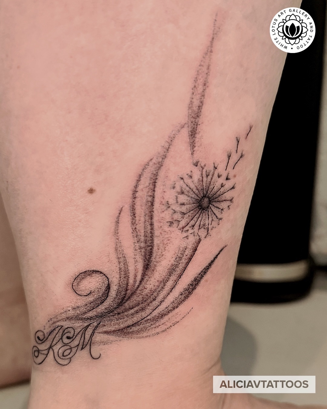 Dandelion seed black and grey tattoo on the forearm by Alicia Vasquez