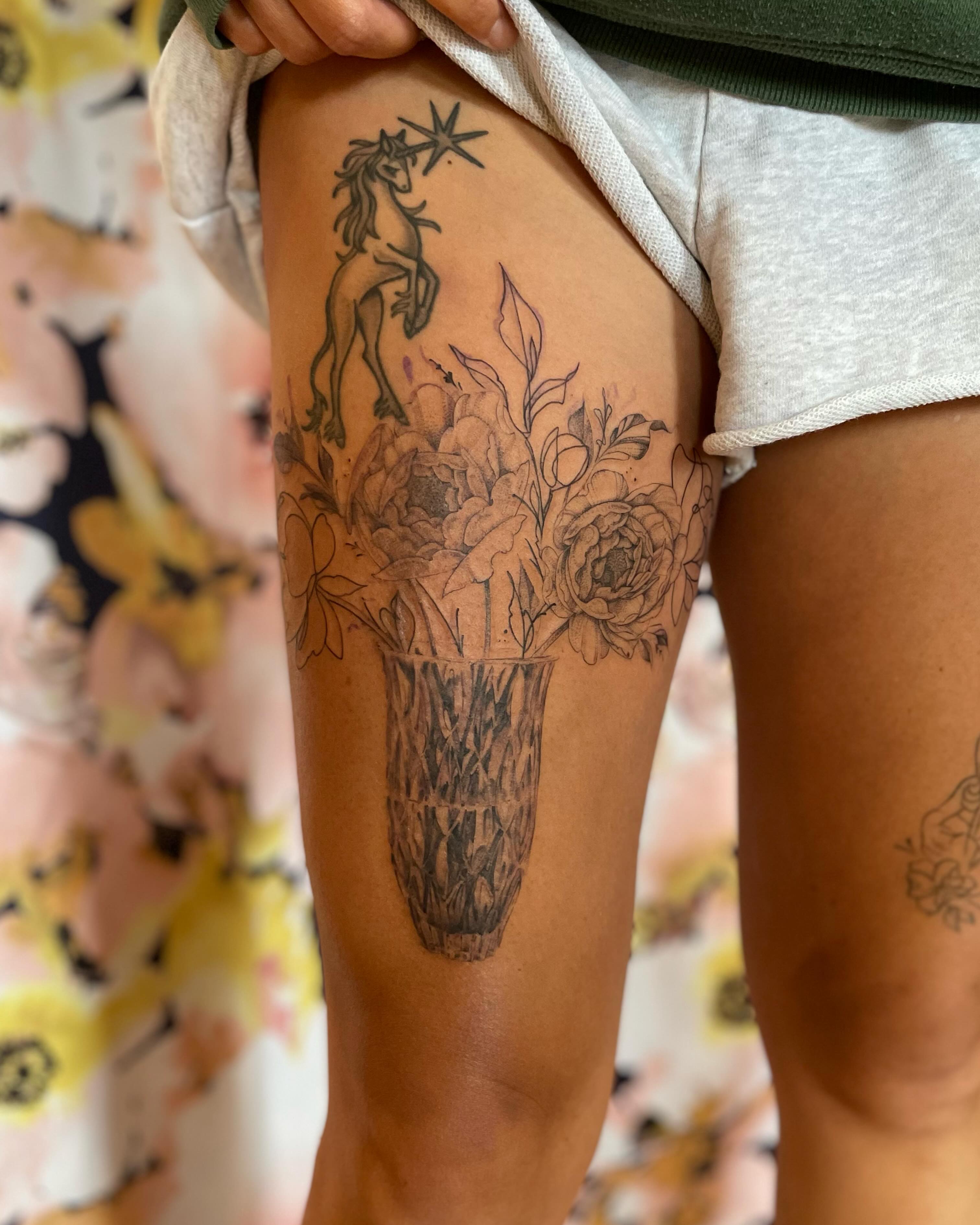 Flower bouquet with unicorn black and grey tattoo on the thigh by paige  l  ink shrink tattoo