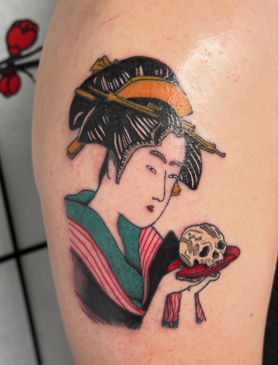 Geisha holding a skull neo-traditional tattoo on the upper arm by 🌛 𐌀𐌋𐌄𐋄𐌉𐌔 🌜