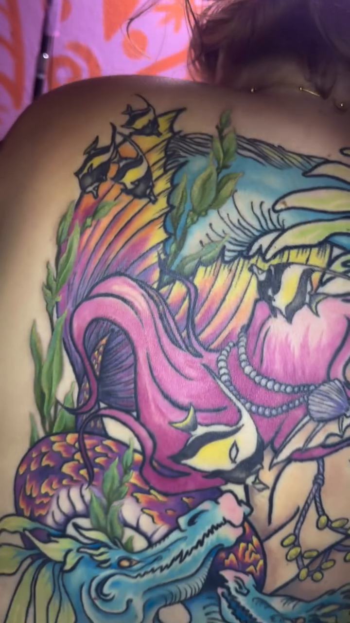 Mermaid with dragon and waves watercolor tattoo on the back by @katikattattoos, Las Vegas, Nevada
