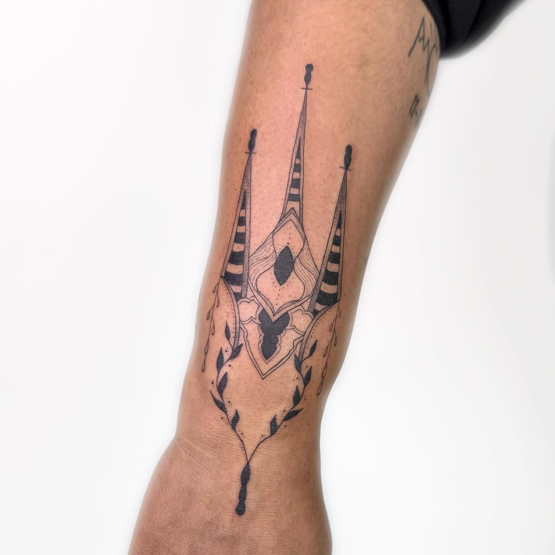 Ornamental trident ornamental tattoo on the forearm by Nika