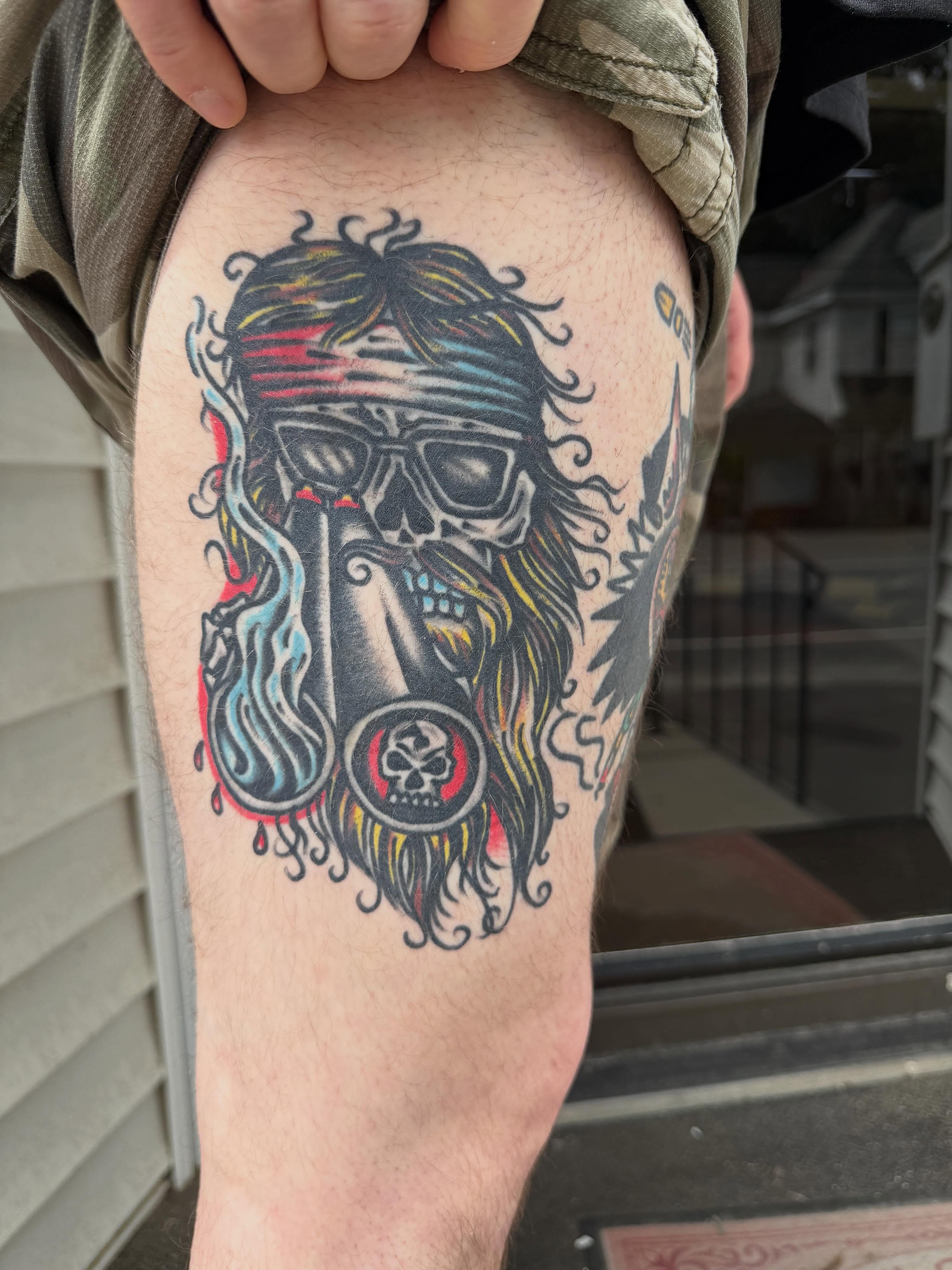 Skull with bandana American traditional tattoo on the thigh by Joshua Speight