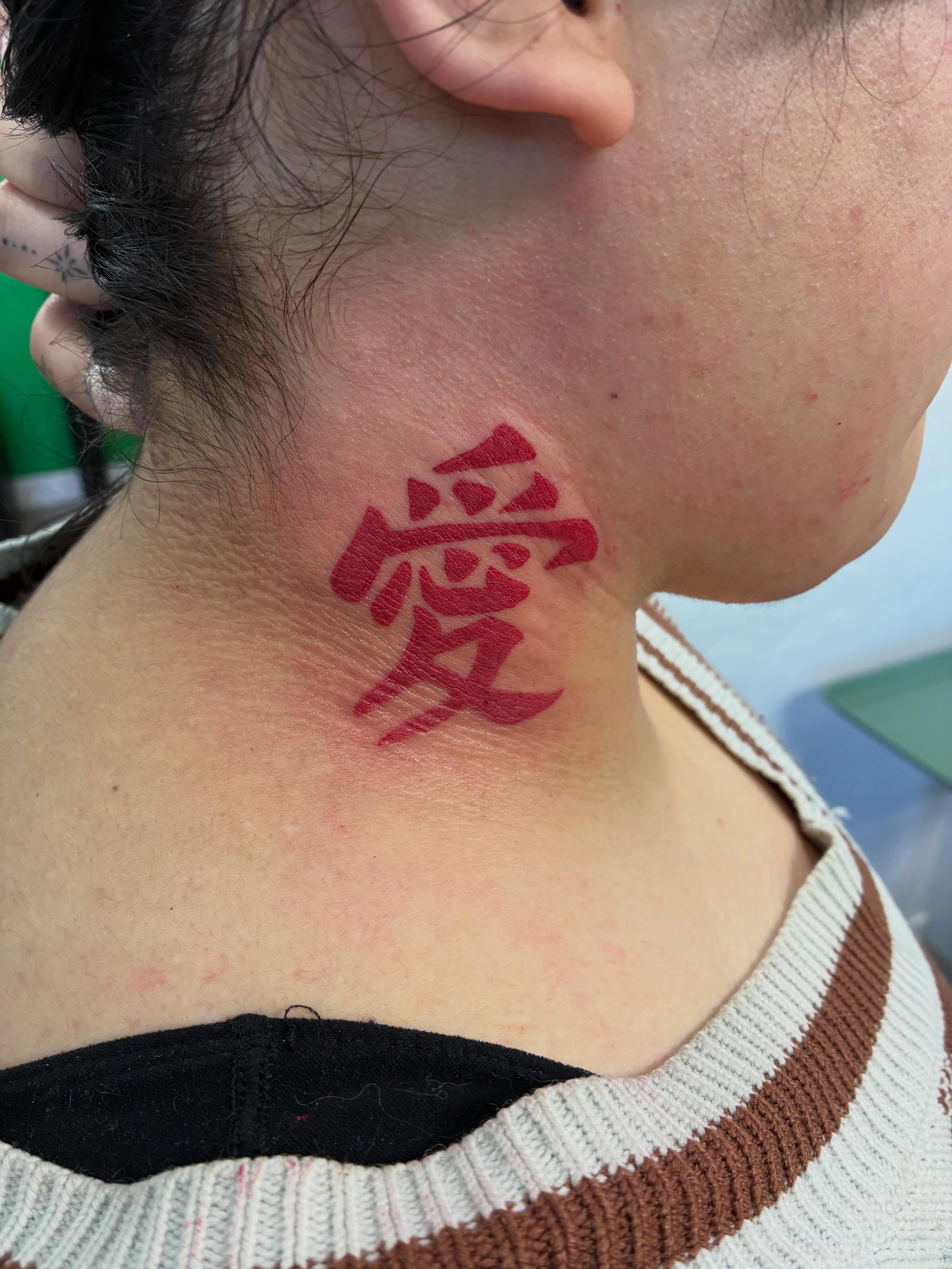 Kanji character lettering script tattoo on the neck by James Ostler
