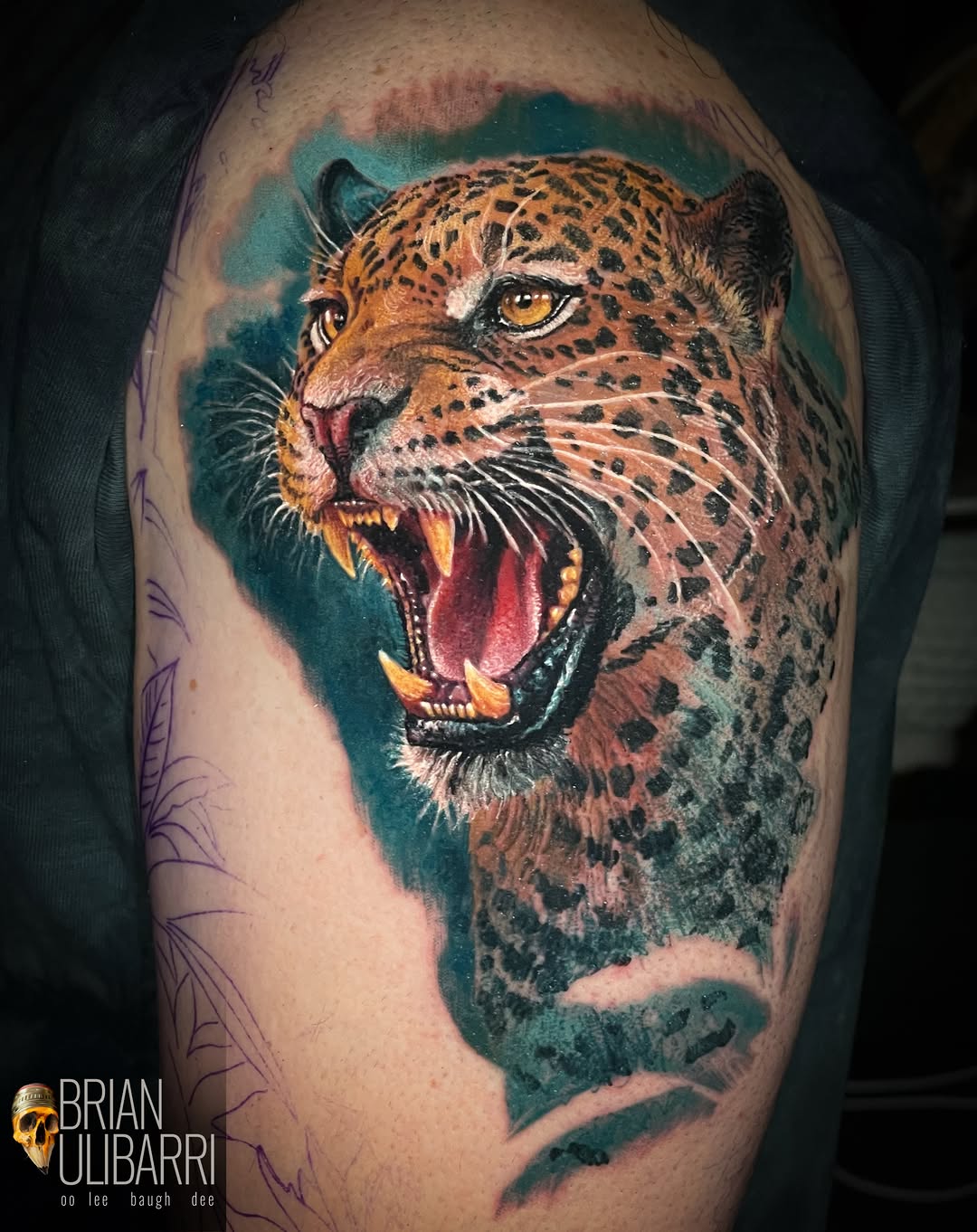 Leopard head realism tattoo on the shoulder by Brian Ulibarri