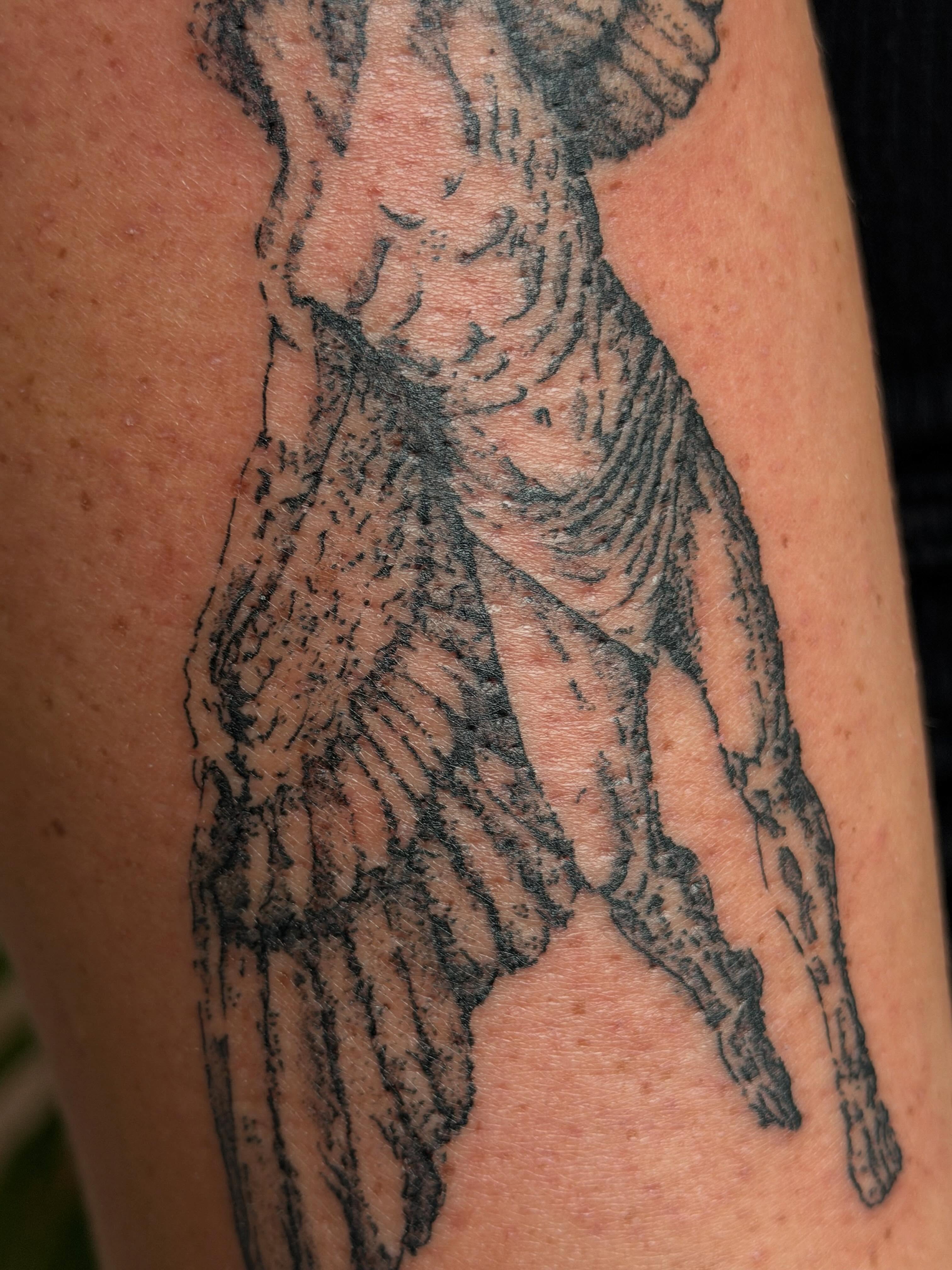 Naked woman black and grey tattoo on the upper arm by Babymaxy Inks Llc