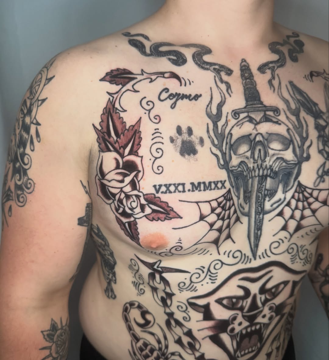 Skull with dagger American traditional tattoo on the chest by Lexie Graff