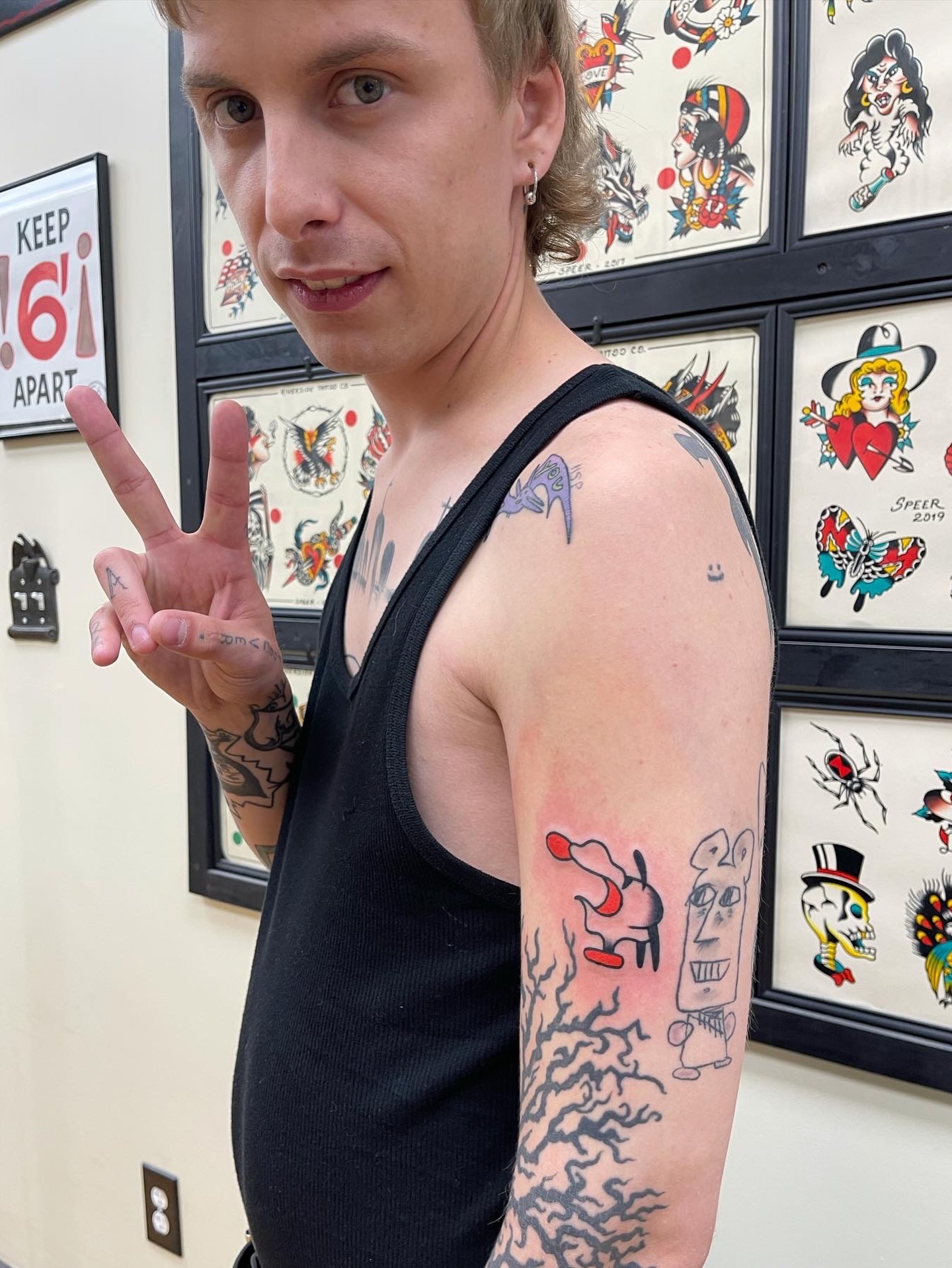 Pig and ghost American traditional tattoo on the upper arm by Maximilian Harrison