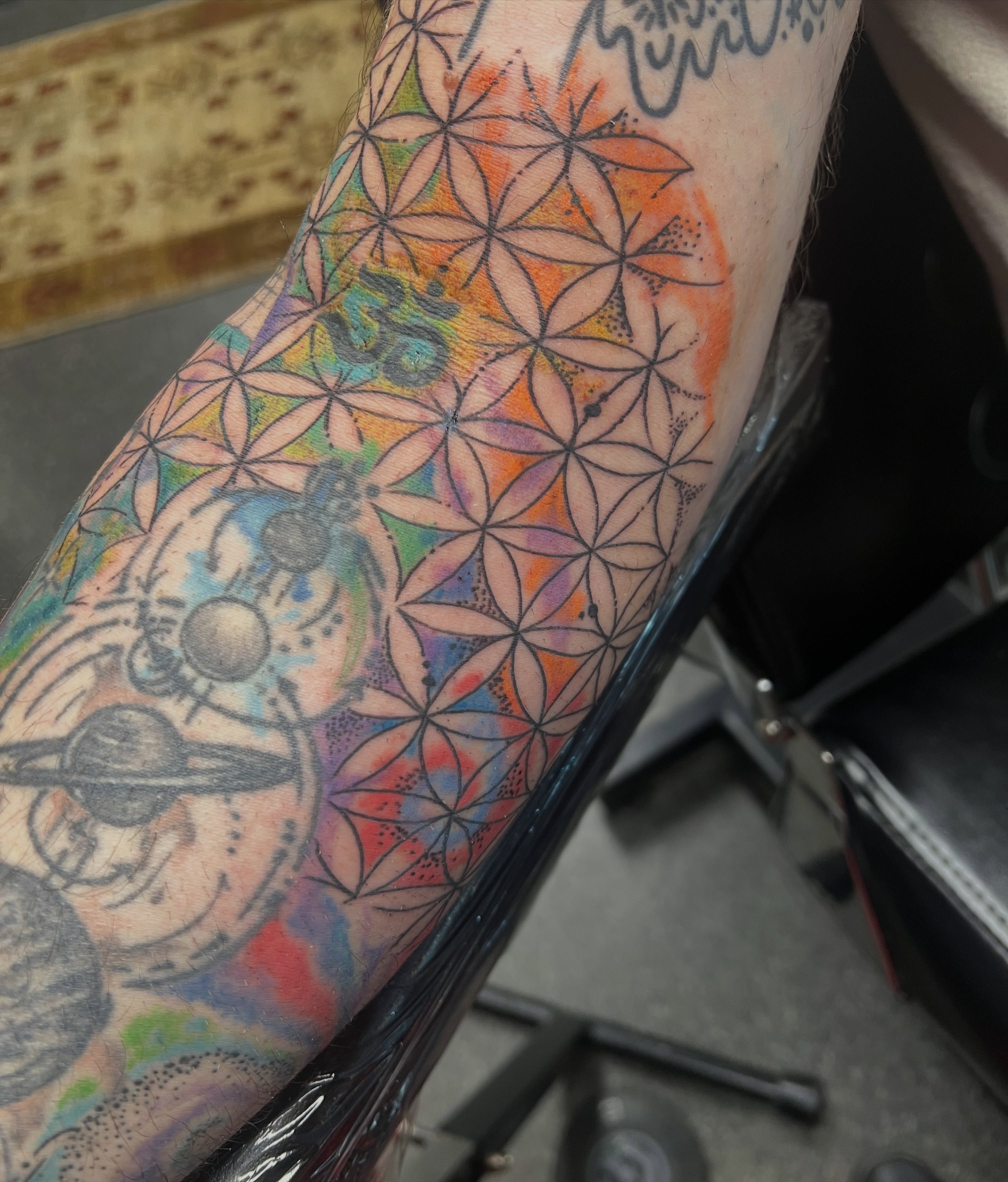 Tattoo by @natalies_tatties — geometric, watercolor
