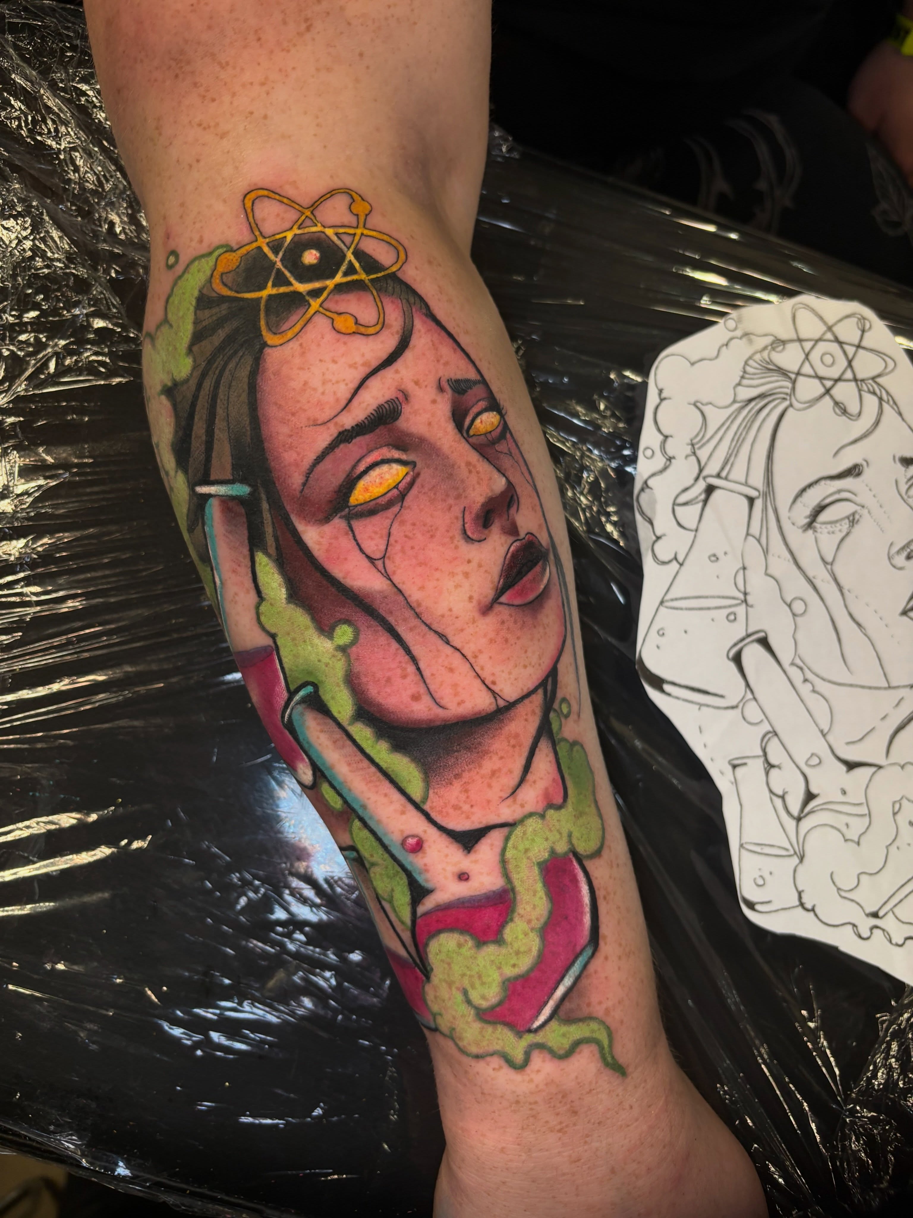 Woman with atom realism tattoo on the forearm by Matt Stolzenburg