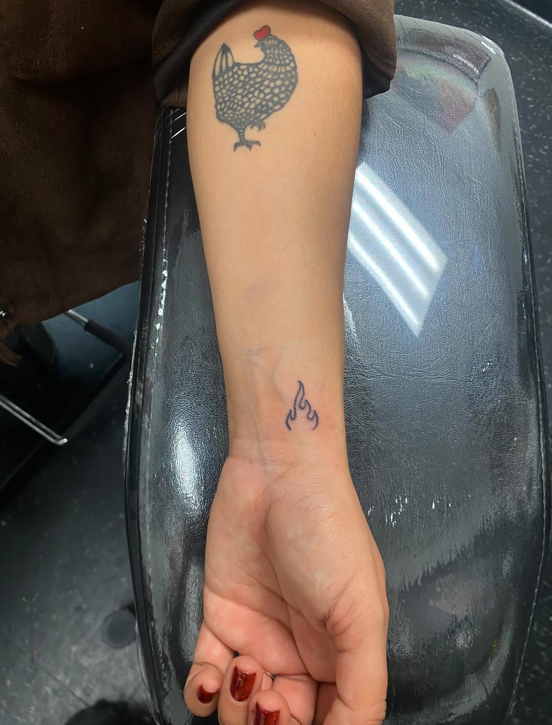 Chicken and flame tattoo on the forearm by Rylan Thorndyke - Tattoo Artist, Las Vegas, Nevada