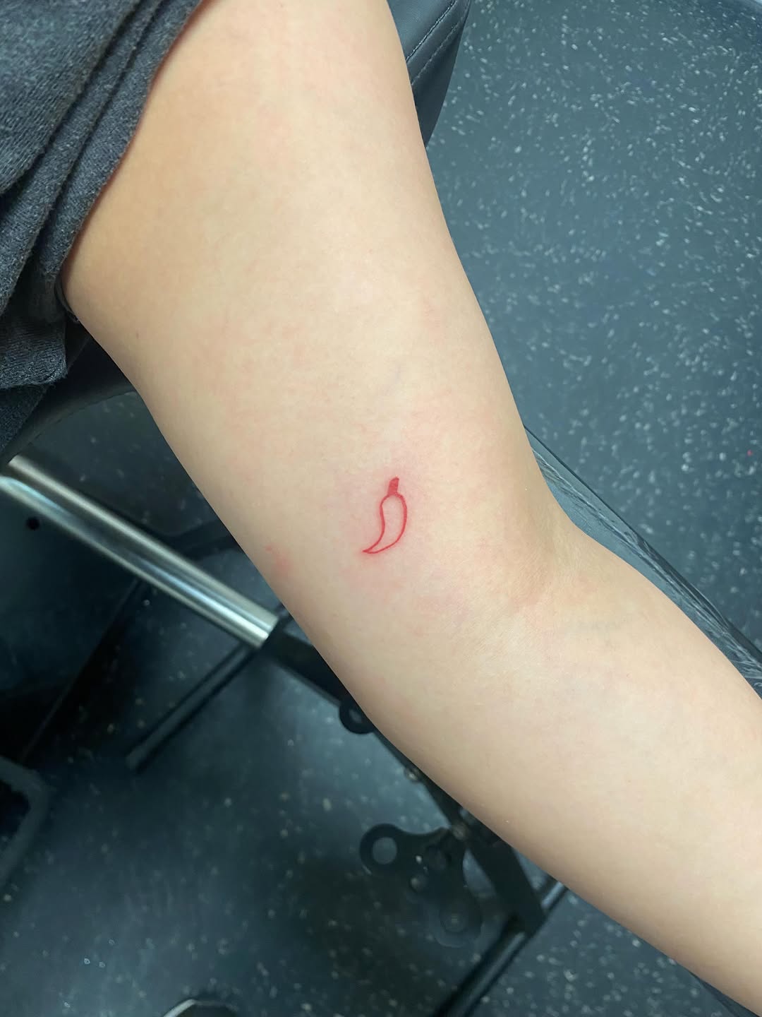 Chili pepper minimalist tattoo on the forearm by Rylan Thorndyke - Tattoo Artist, Las Vegas, Nevada