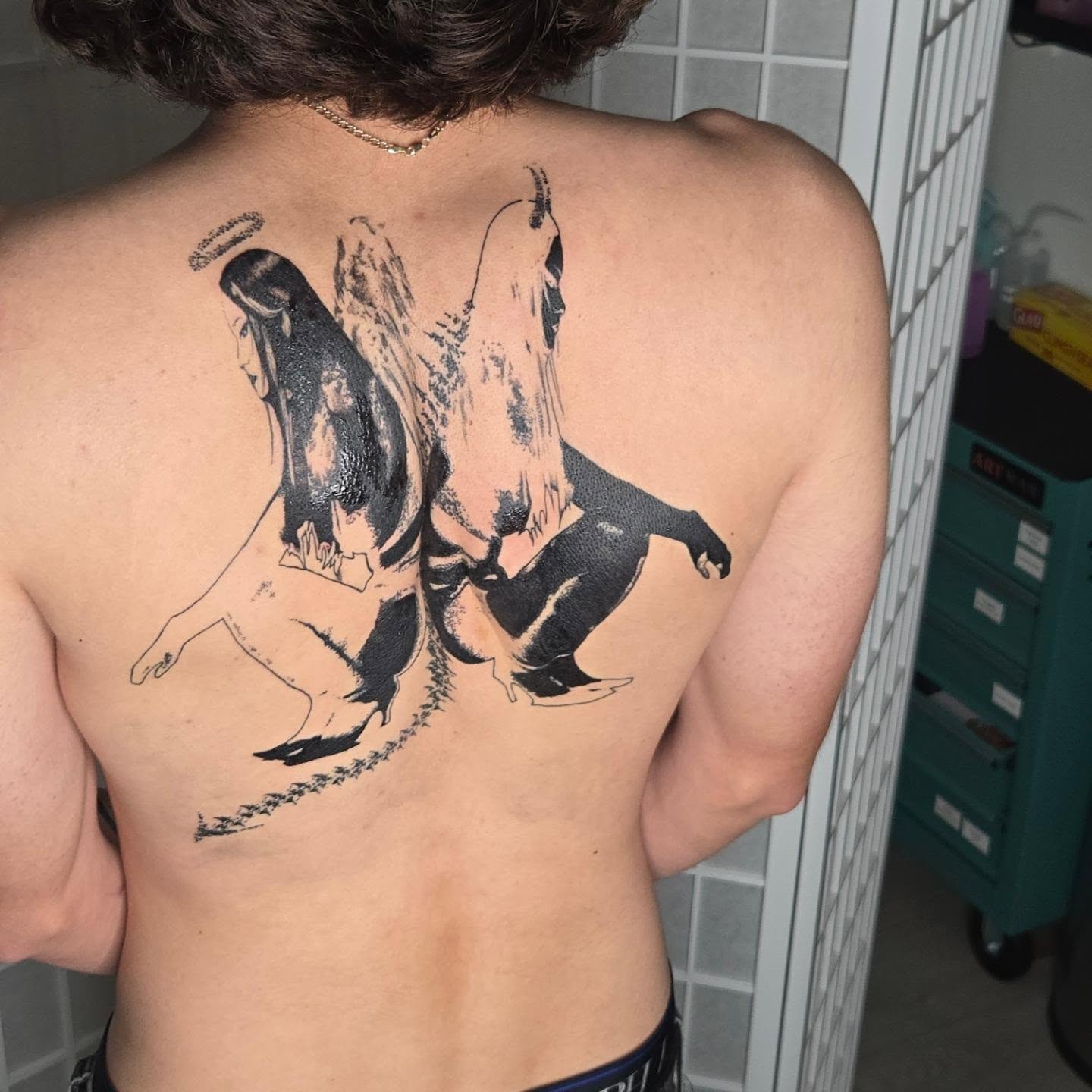 Angels kissing black and grey tattoo on the back by ⚙️ 𝔄𝔞𝔯𝔬𝔫 𝔇. ⚙️