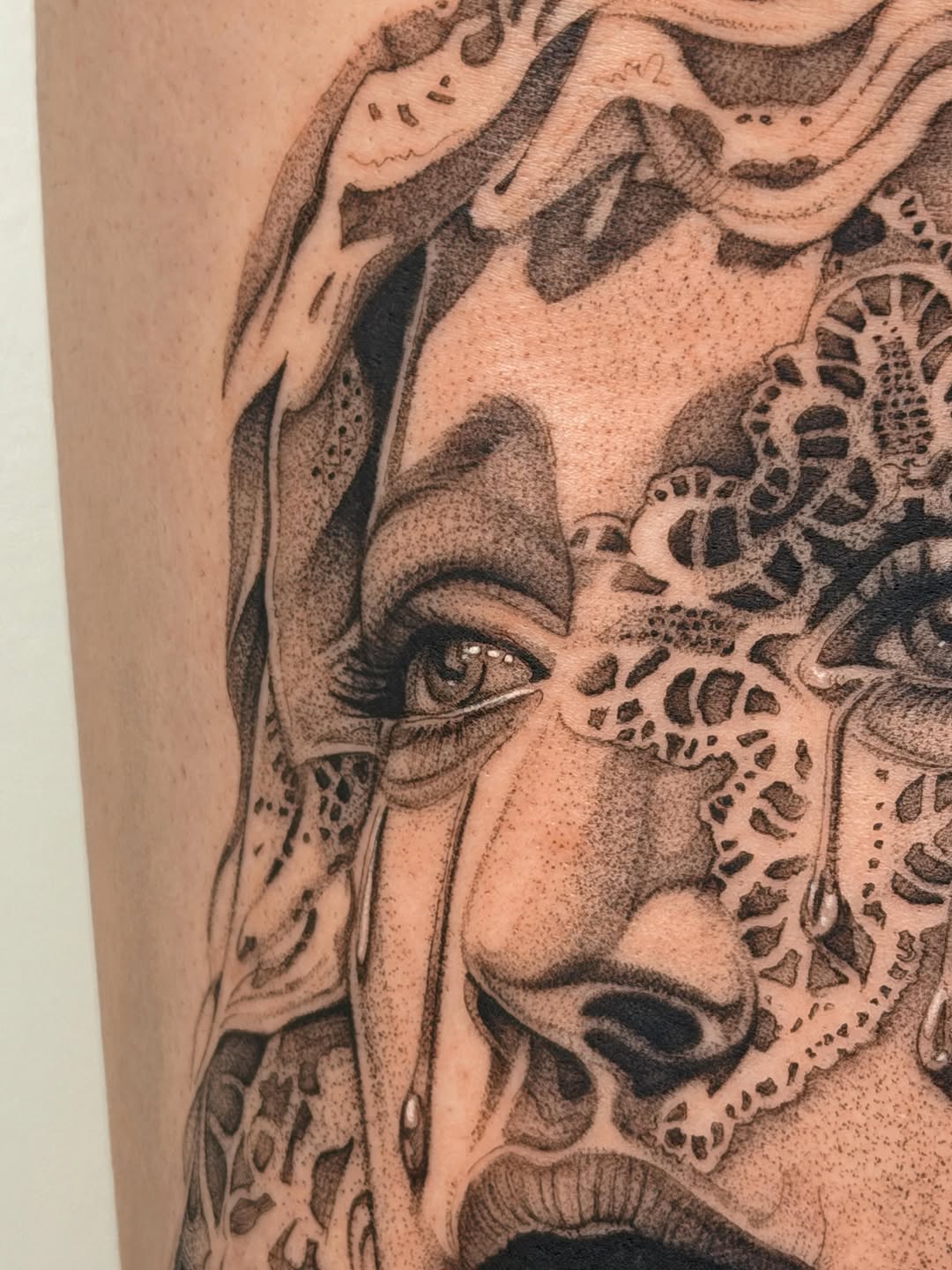 Woman with lace realism tattoo on the forearm by Nate Weaver
