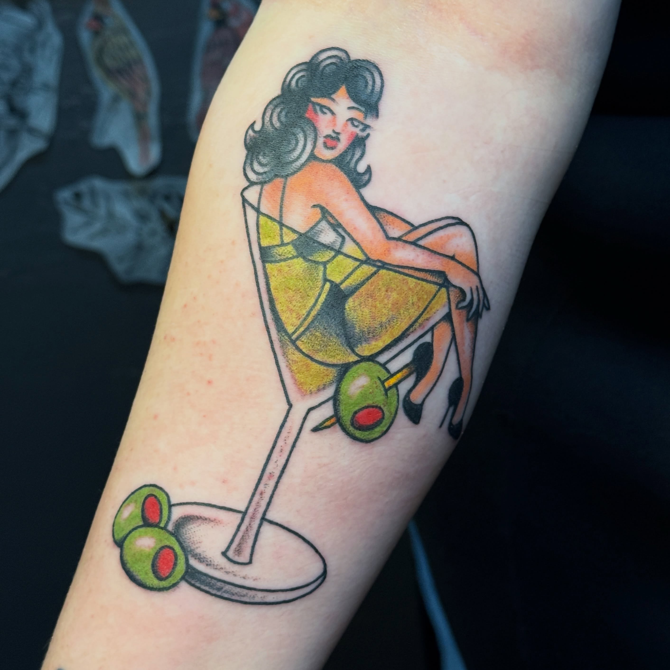 Martini glass with woman American traditional tattoo on the forearm by Traddy Maddie ๐