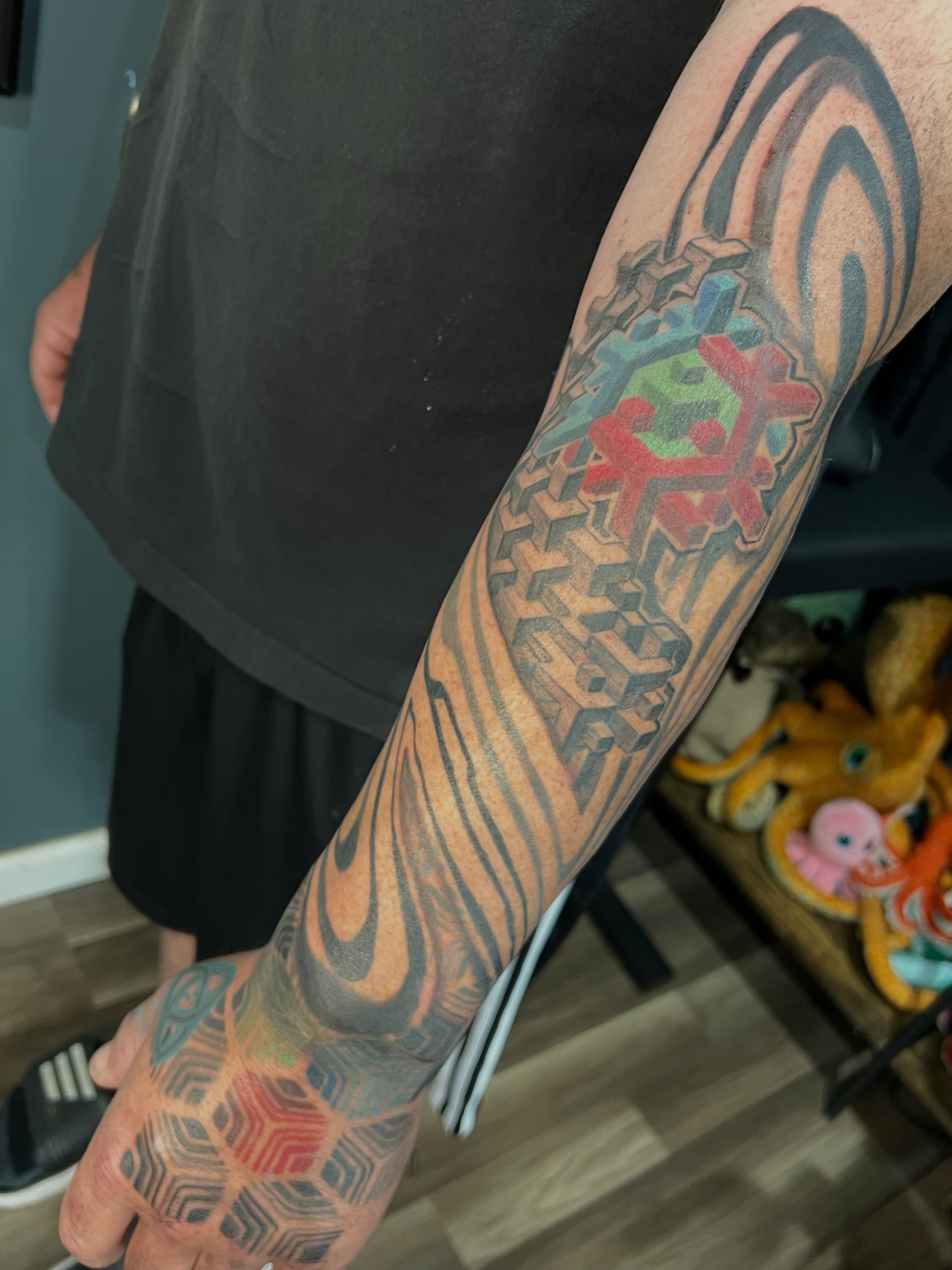 Geometric pattern geometric tattoo on the forearm by Simón, Newington, Connecticut