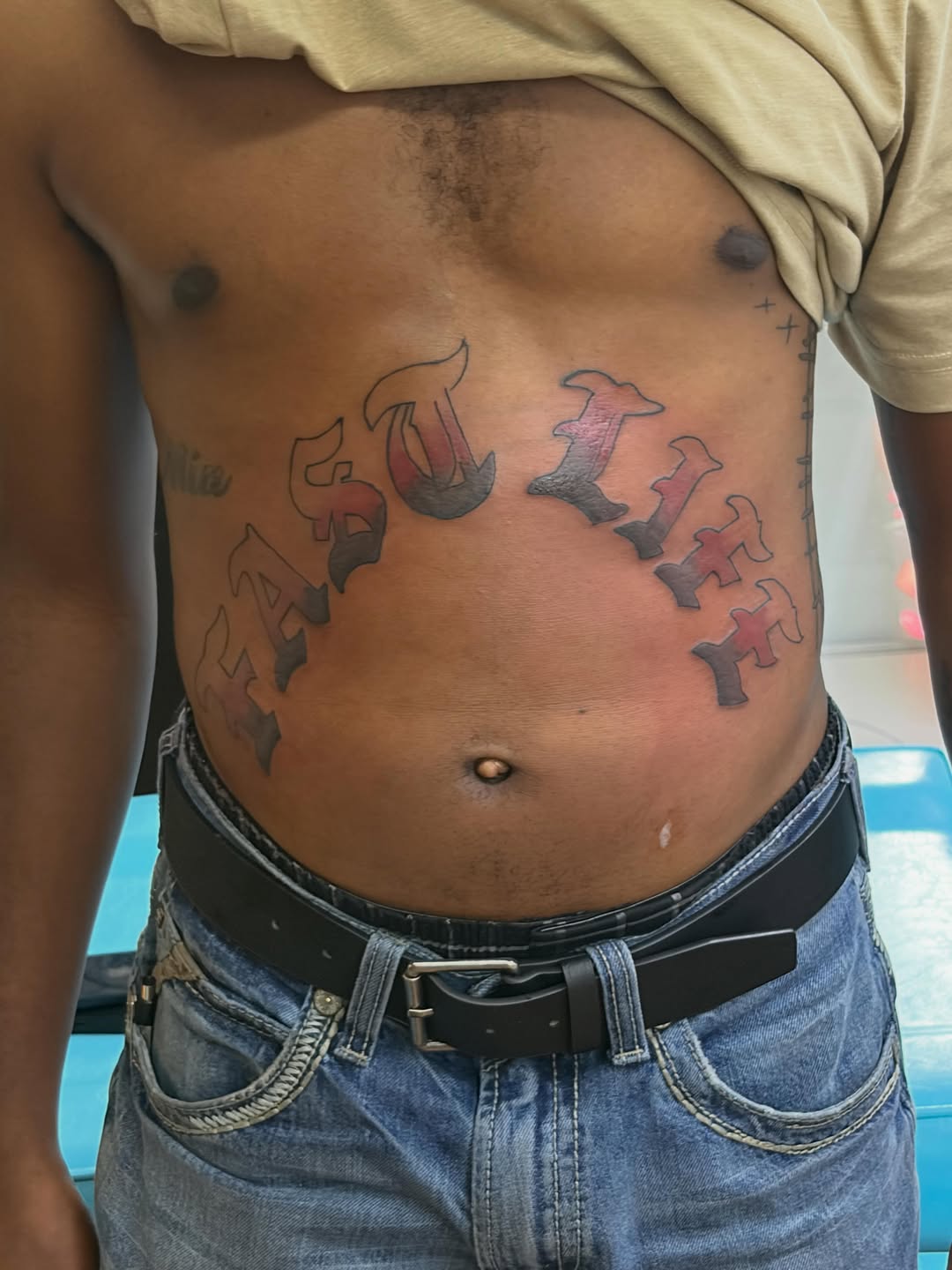 Script lettering tattoo on the torso by Jae the artist🫡