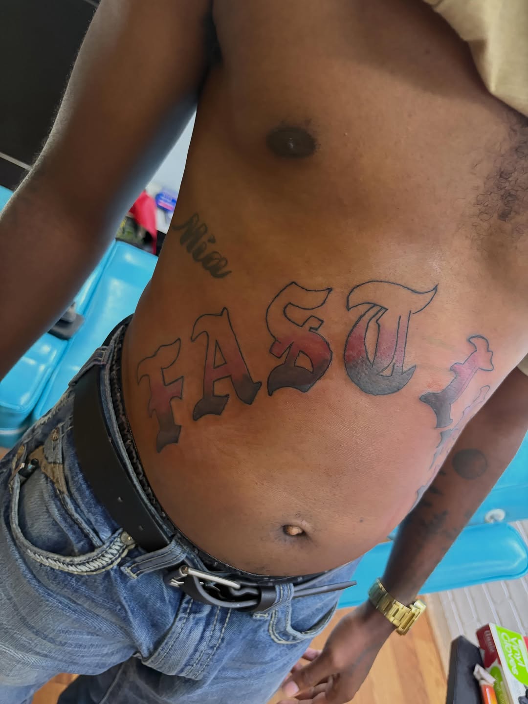 FAST lettering tattoo on the chest by Jae the artist🫡