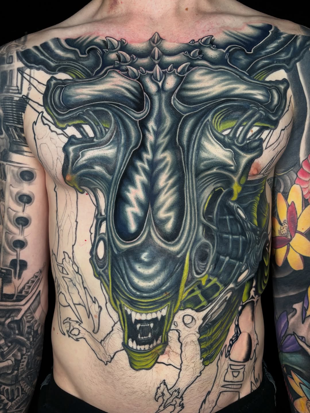 Alien xenomorph chest piece realism tattoo on the chest by Jon Ronzka