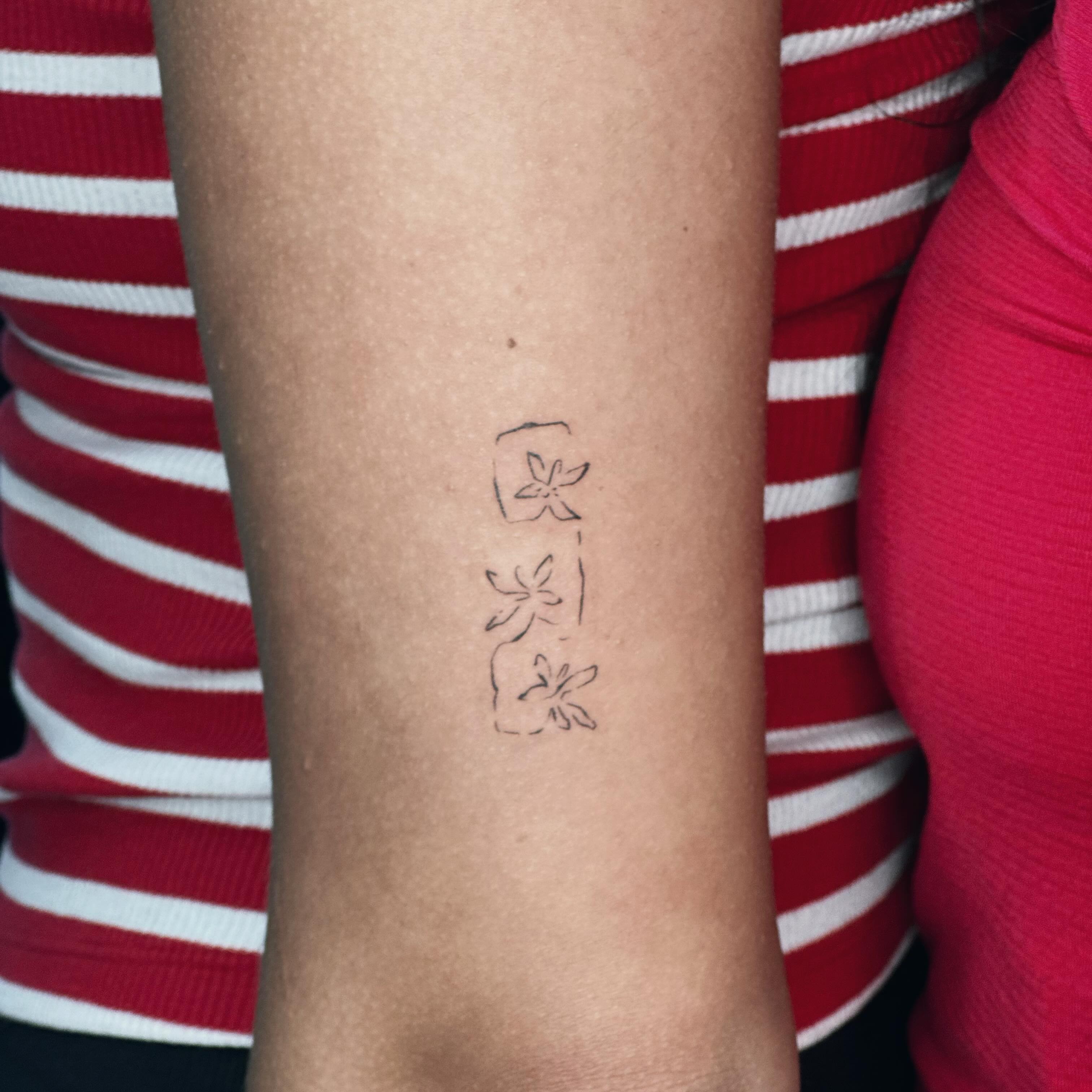 Cherry blossoms dotwork tattoo on the forearm by Liv