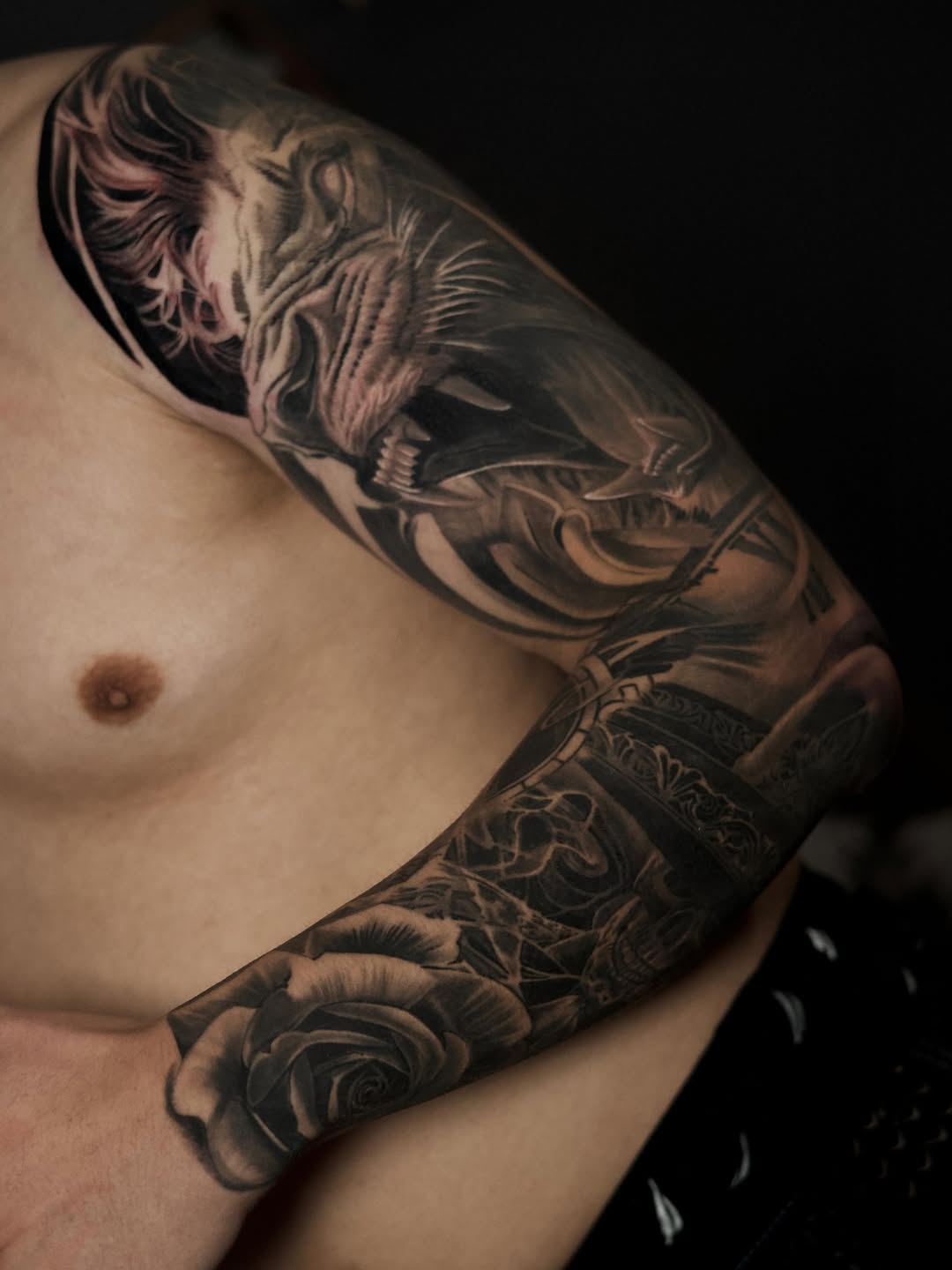 Lion and rose sleeve Japanese tattoo on the upper arm by Bapone