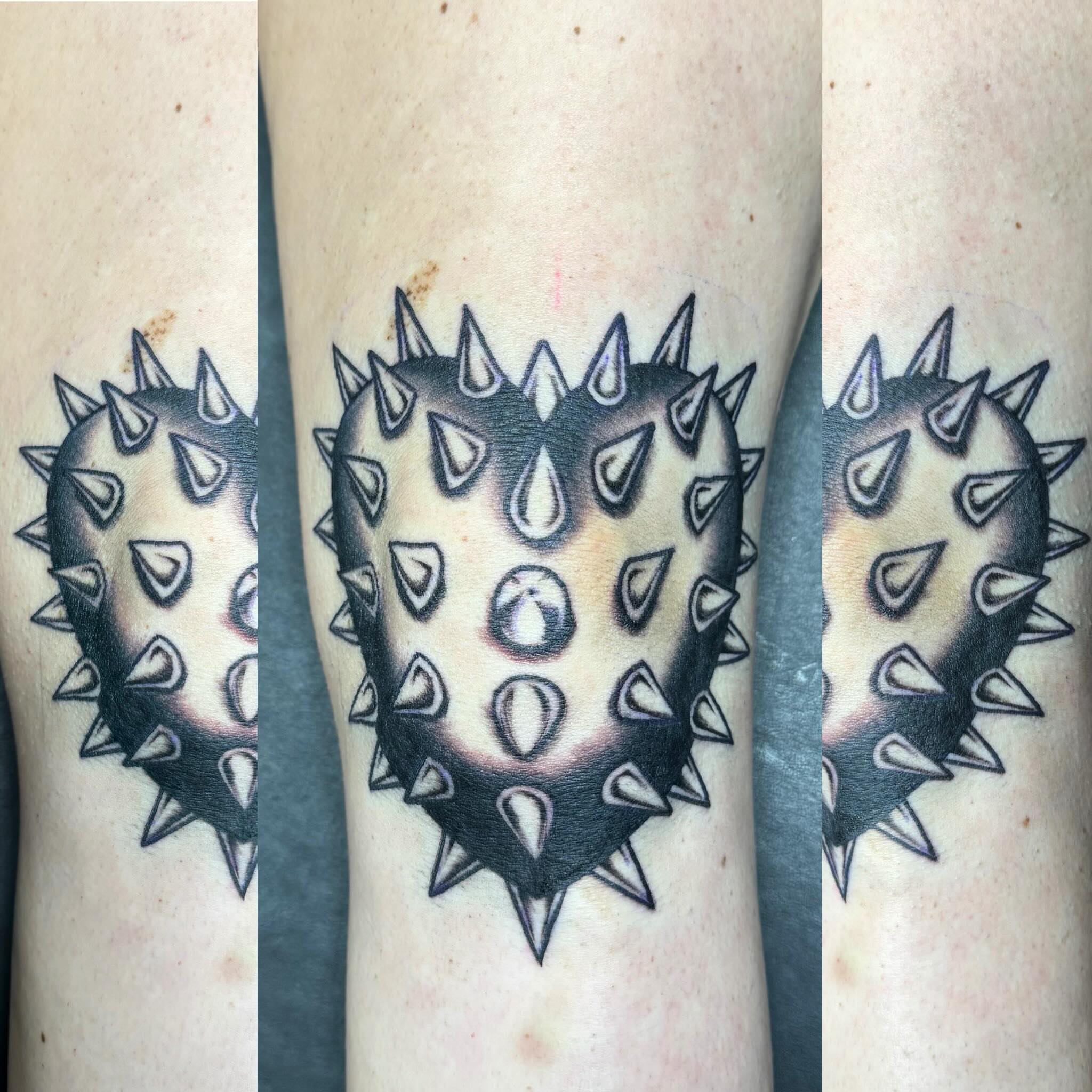 Spiky heart black and grey tattoo on the forearm by Kyle Holt