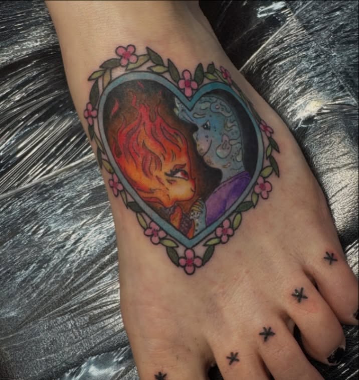 Heart with fire and moon illustrative tattoo on the foot by Jada Reynolds