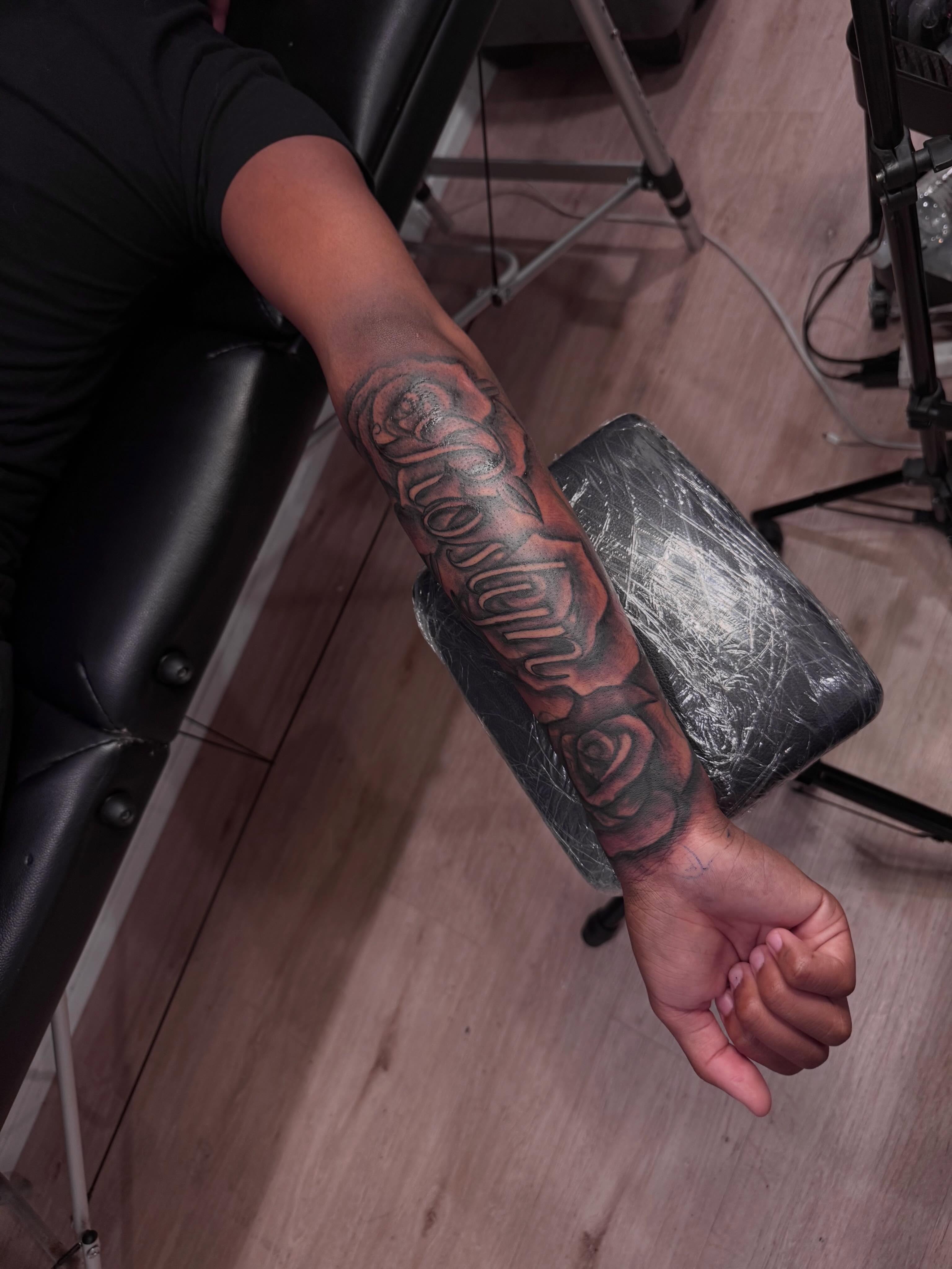 Roses and script black and grey tattoo on the forearm by inkedbylii, Philadelphia, Pennsylvania