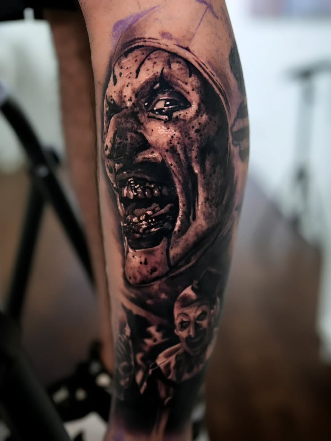 Horror clown portrait realism tattoo on the forearm by Viktor Nachev