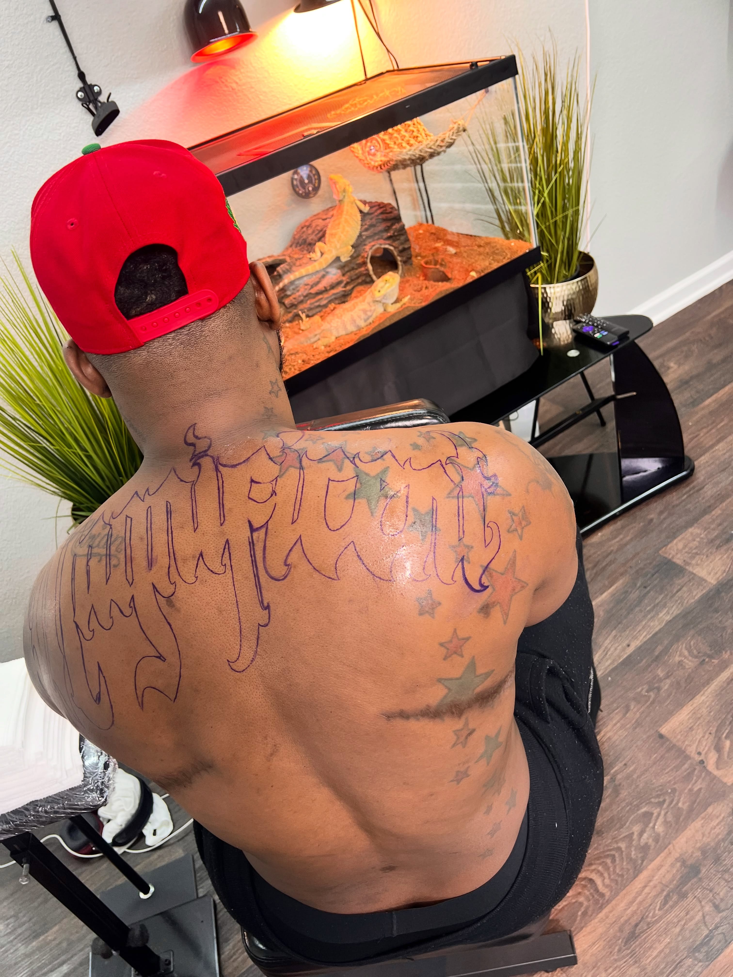 Script lettering lettering script tattoo on the back by Deonte Dwayne Durham