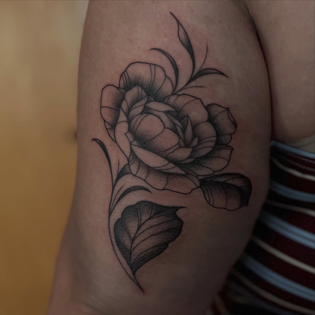 Rose dotwork tattoo on the upper arm by Tattoo, San Diego, California