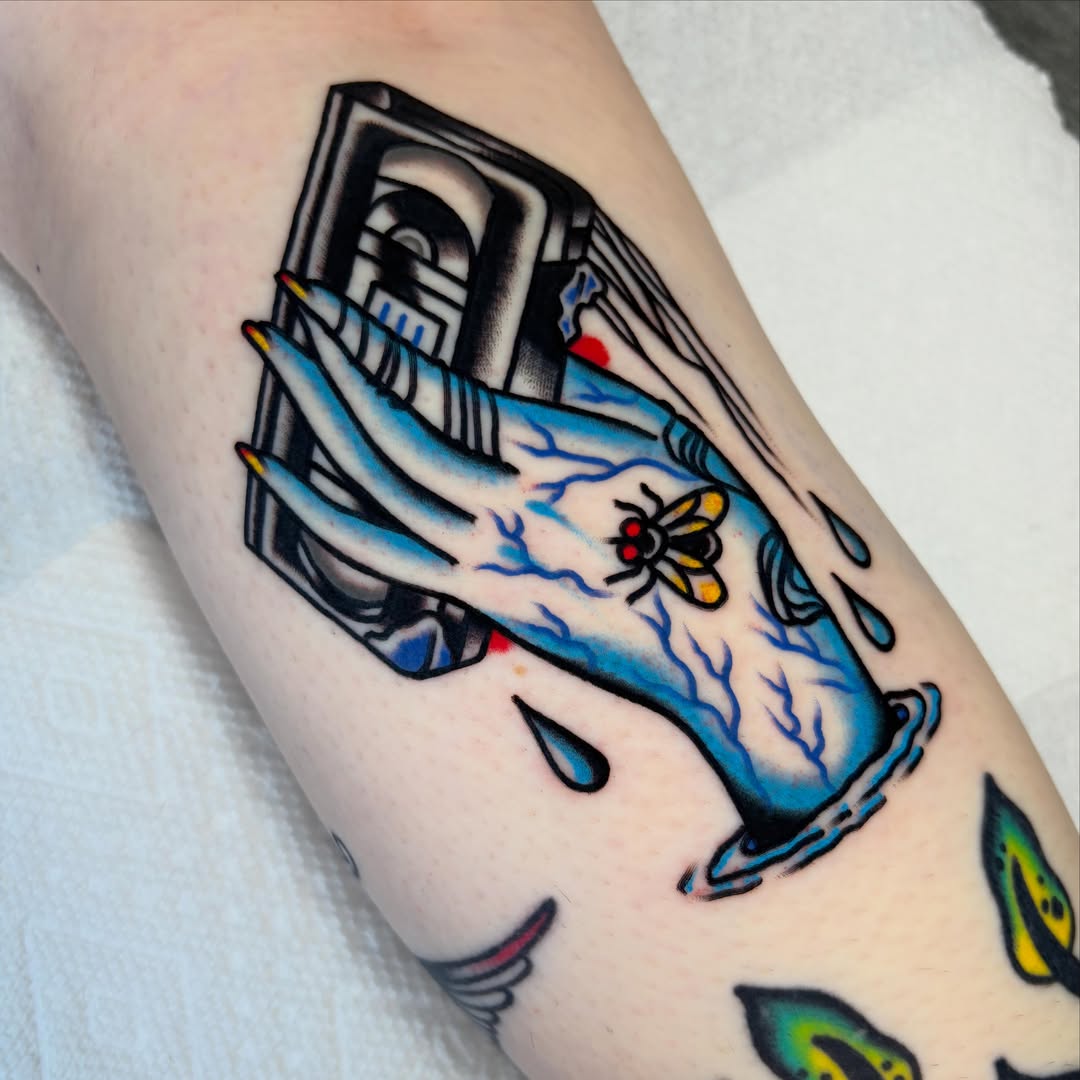Hand with bee American traditional tattoo on the forearm by Zoe Margot