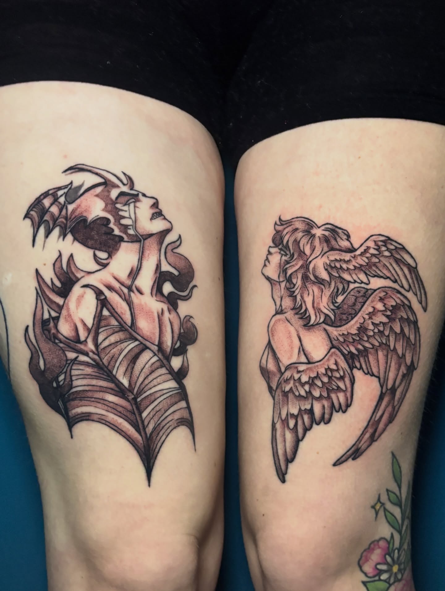 Angel and demon black and grey tattoo on the thigh by 🌸Mandy Blossoms🌸The Cosplaying Tattoo Artist🌸