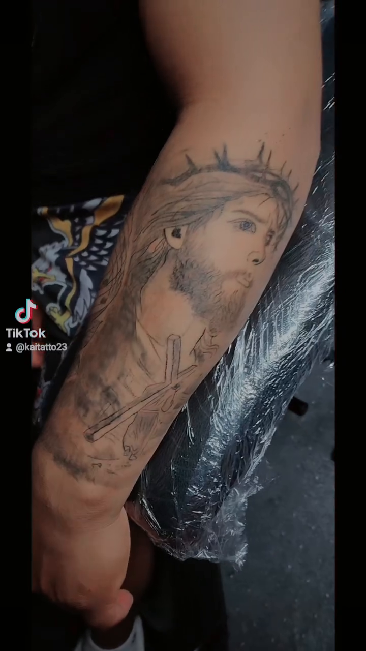 Jesus Christ and a lion Chicano tattoo on the forearm by Kai_Tattoo