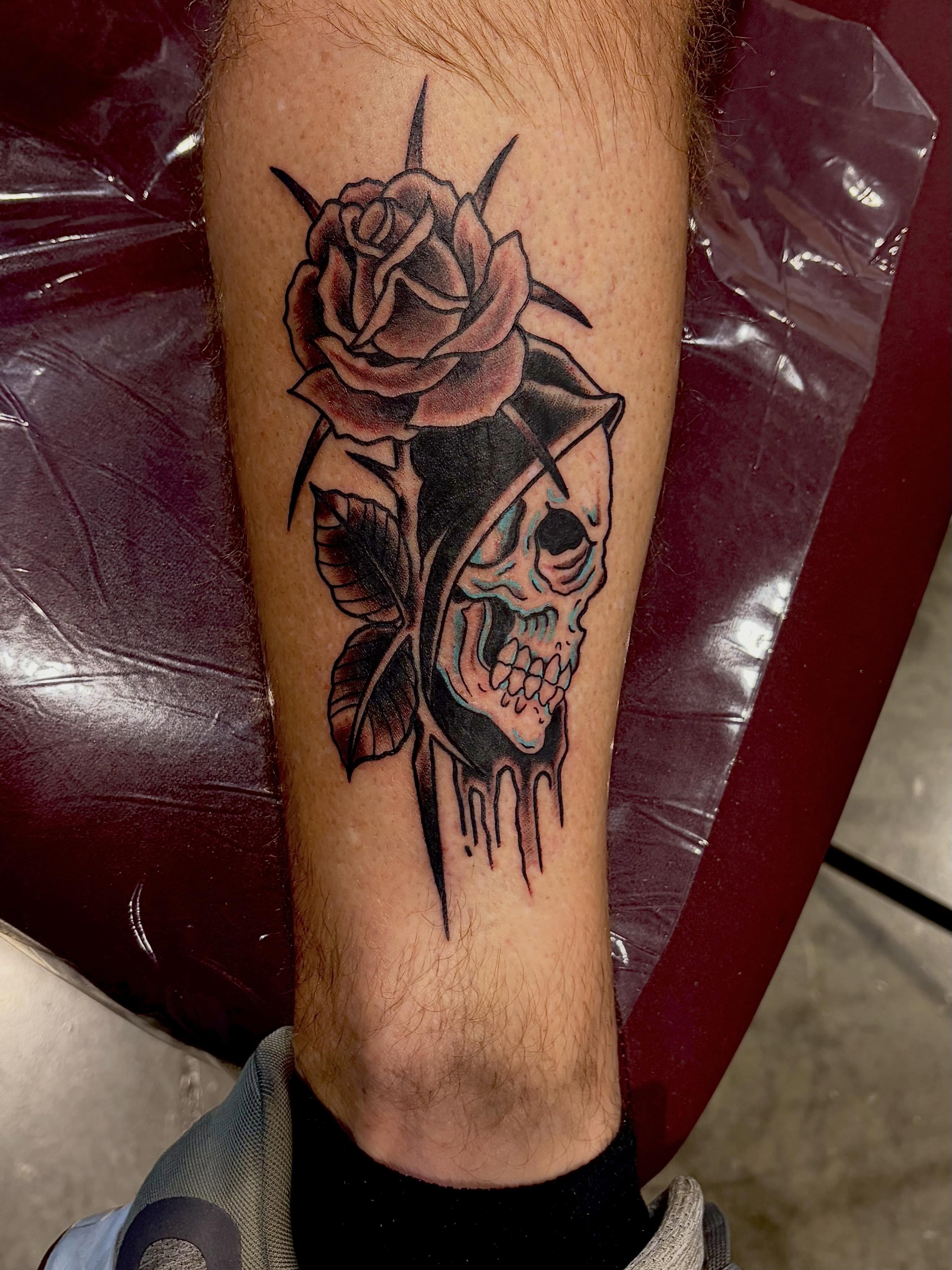 Skull and rose realism tattoo on the forearm by @rayscott_tattoo