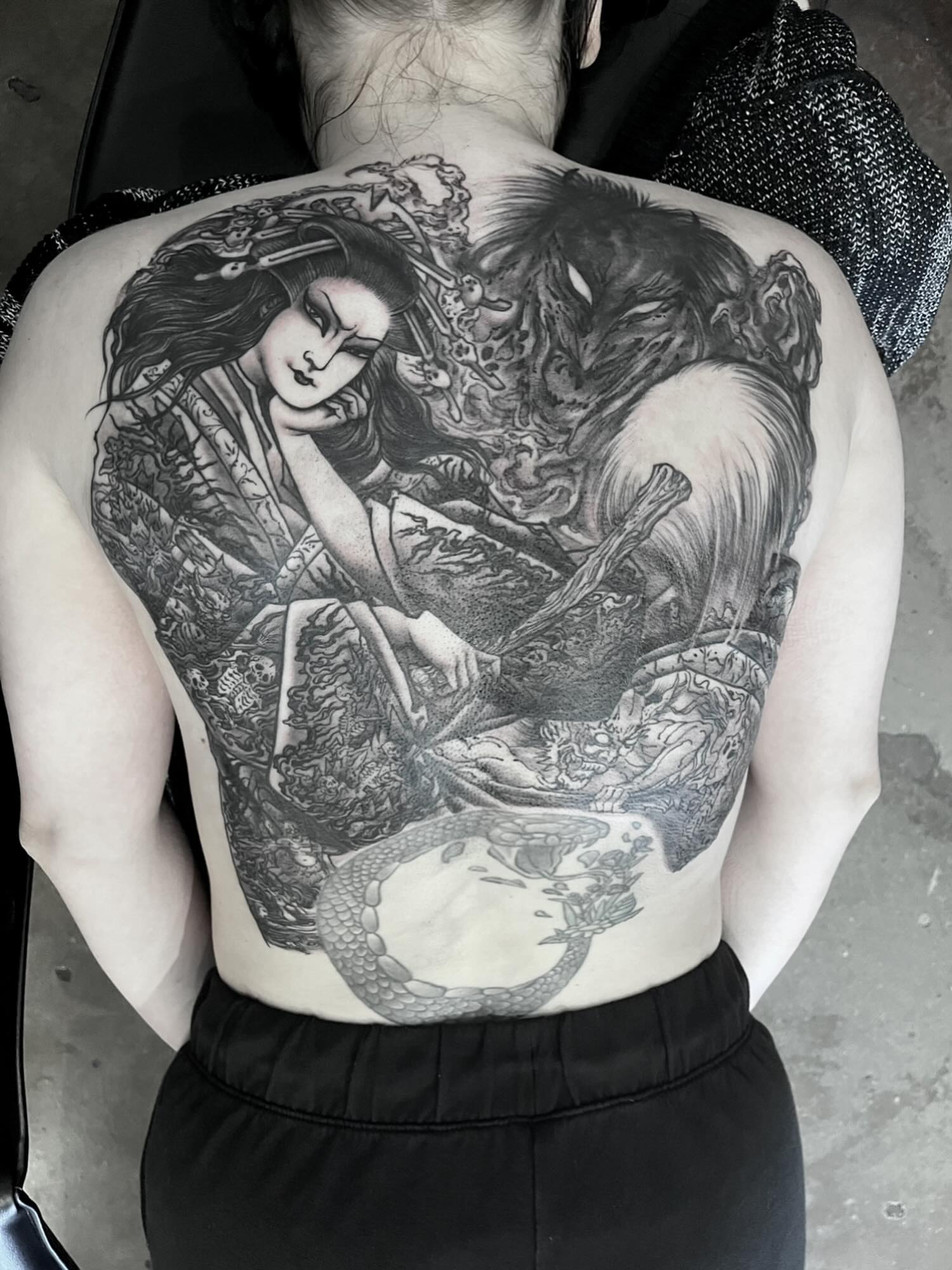 Geisha and dragon realism tattoo on the back by Nathan Esteras