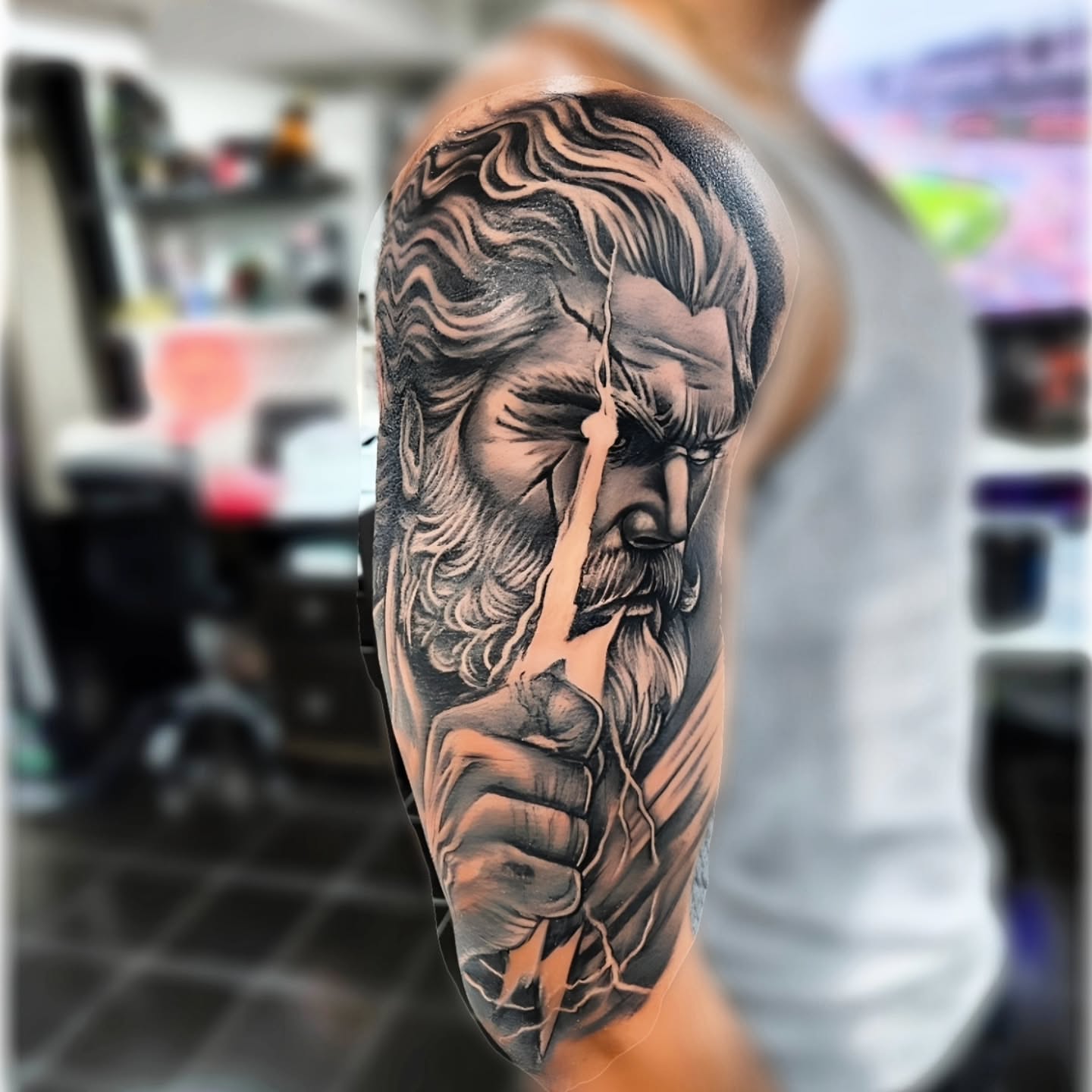 Bearded man realism tattoo on the upper arm by "El Jose" Tattoo