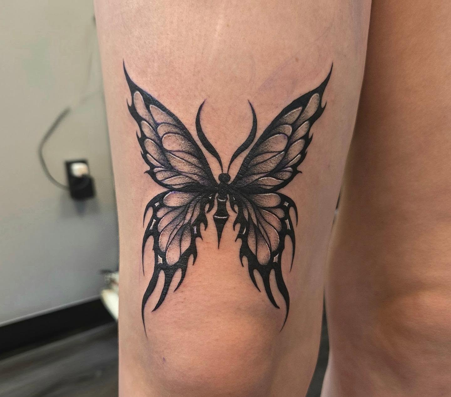 Butterfly black and grey tattoo on the forearm by Danielle Elizabeth
