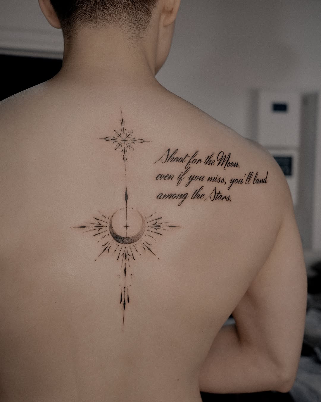 Moon and stars with quote ornamental tattoo on the back by Easy