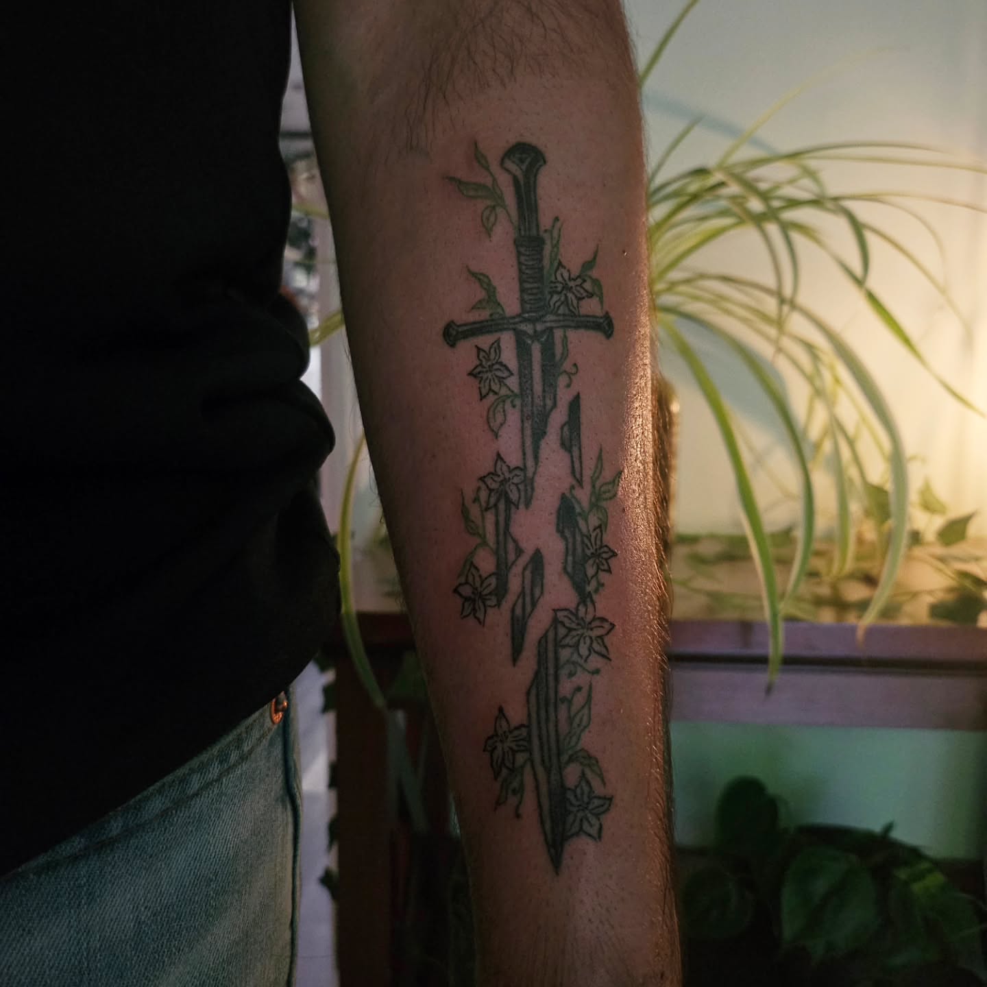 Sword and flowers black and grey tattoo on the forearm by ݁˖