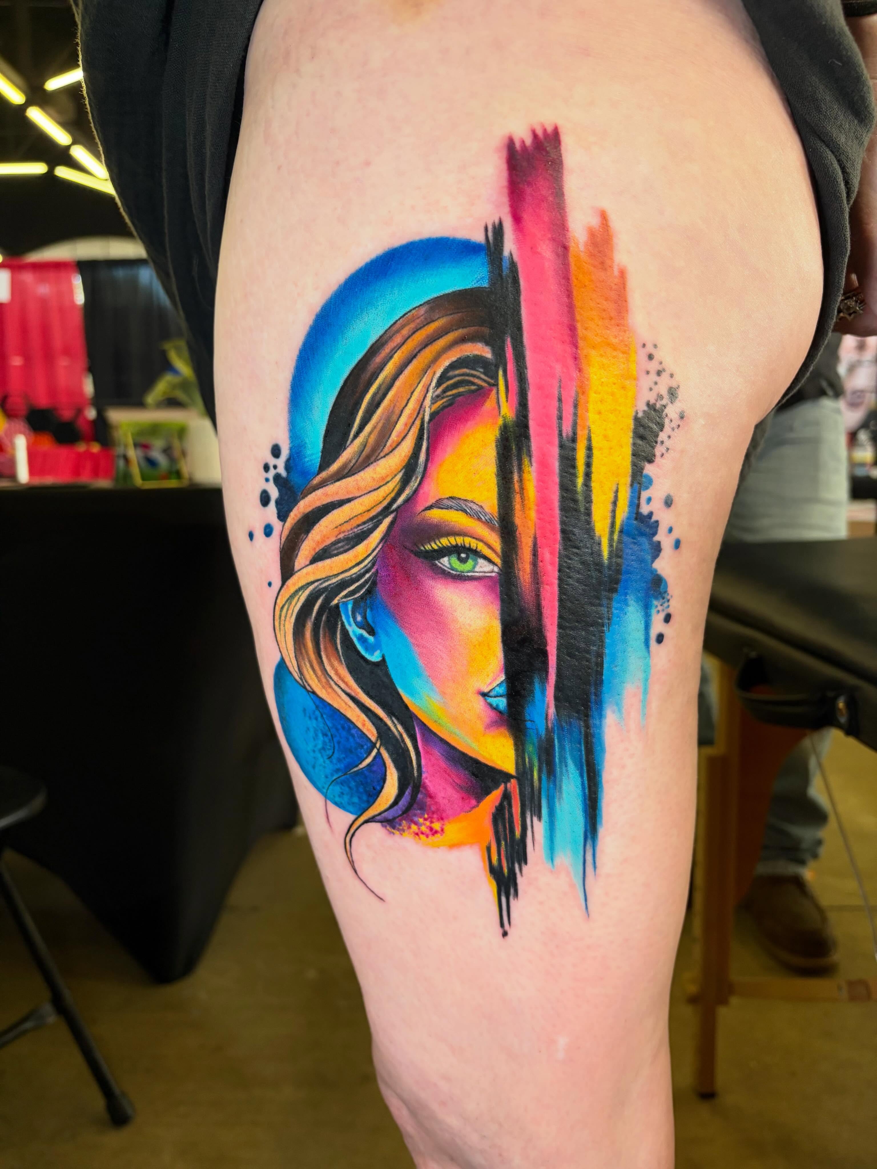 Abstract woman watercolor tattoo on the thigh by Rachel Sellers
