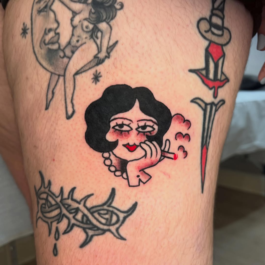 Smoking woman American traditional tattoo on the thigh by Gus Roach Graves