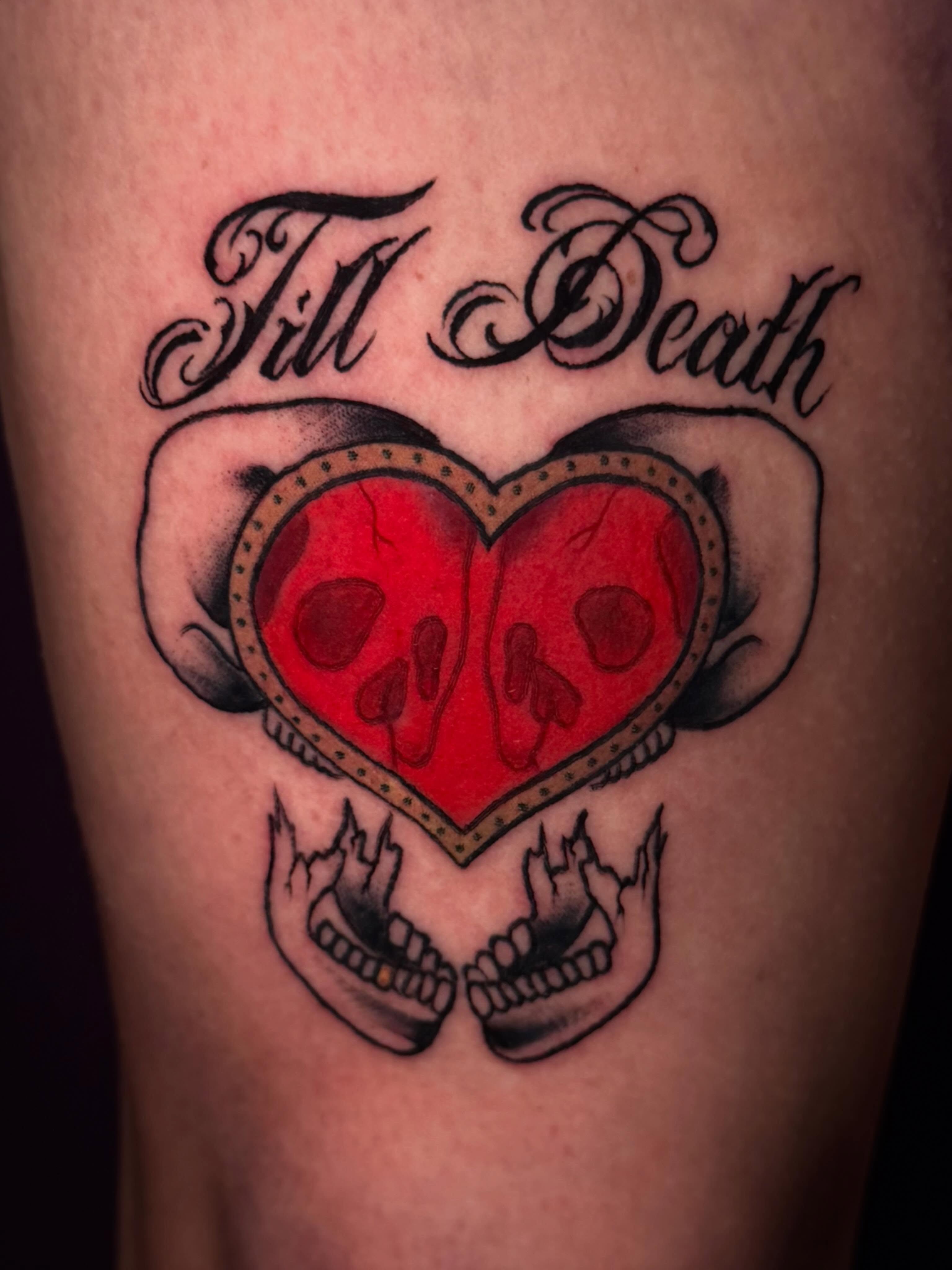 Heart with skulls American traditional tattoo on the thigh by Lydia