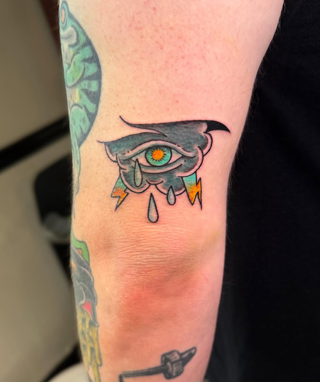 Stormy eye with lightning American traditional tattoo on the forearm by Ivy-Jade Edwards, Memphis, Tennessee