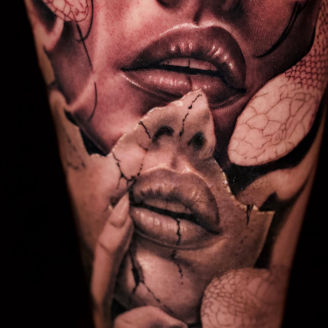 Cracked face with snakes realism tattoo on the forearm by April Lynn